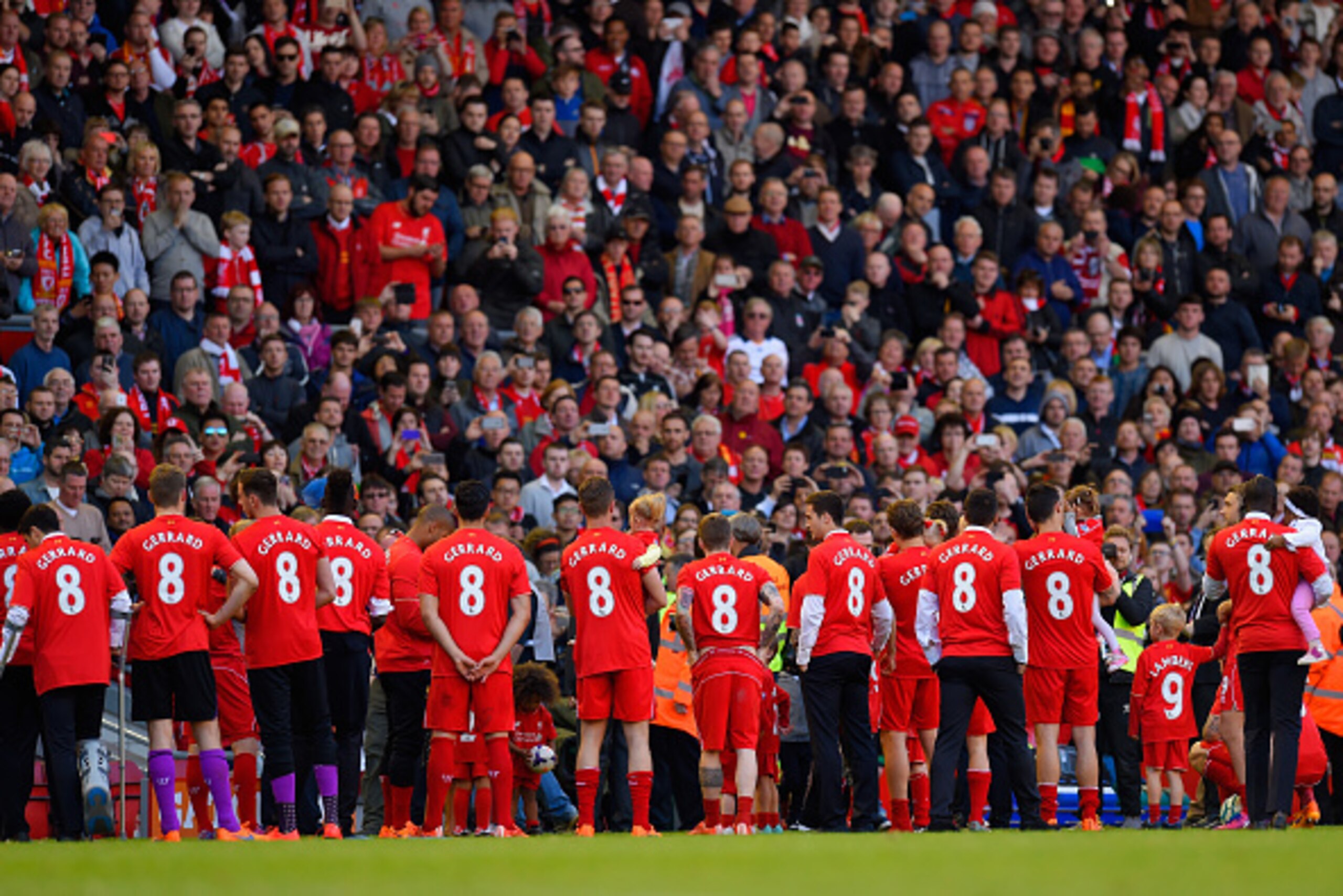 LIVERPOOL, ENGLAND - MAY 16: Liverpool players wear Steven Gerrard of Liverpool replica shirts as they wait to pay tribute to Steven Gerrard on his final game at Anfield during the Barclays Premier League match between Liverpool and Crystal Palace at Anfi