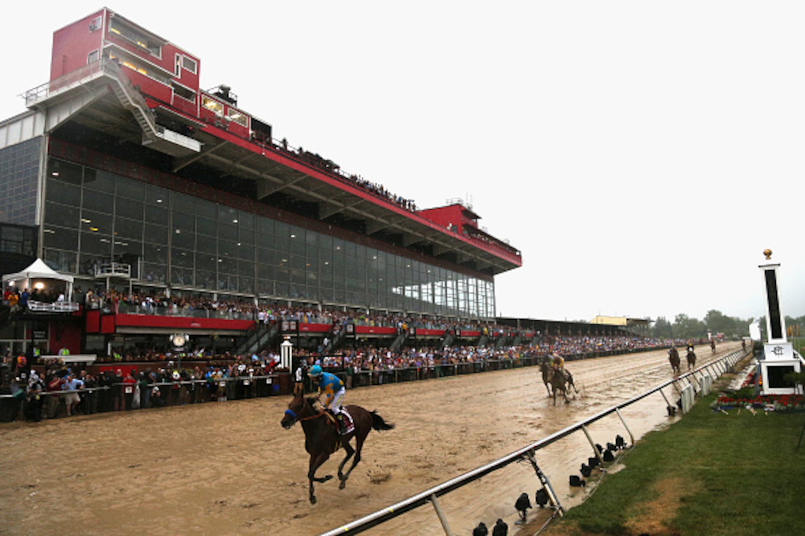 BALTIMORE, MD - MAY 16:  American Pharoah #1 ridden by Victor Espinoza crosses the finish line to win the 140th running of the Preakness Stakes at Pimlico Race Course on May 16, 2015 in Baltimore, Maryland.  (Photo by Patrick Smith/Getty Images)
