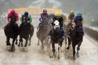 May 16, 2015; Baltimore, MD, USA; Victor Espinoza aboard American Pharoah leads the pack during the 140th Preakness Stakes at Pimlico Race Course. Mandatory Credit: Winslow Townson-USA TODAY Sports