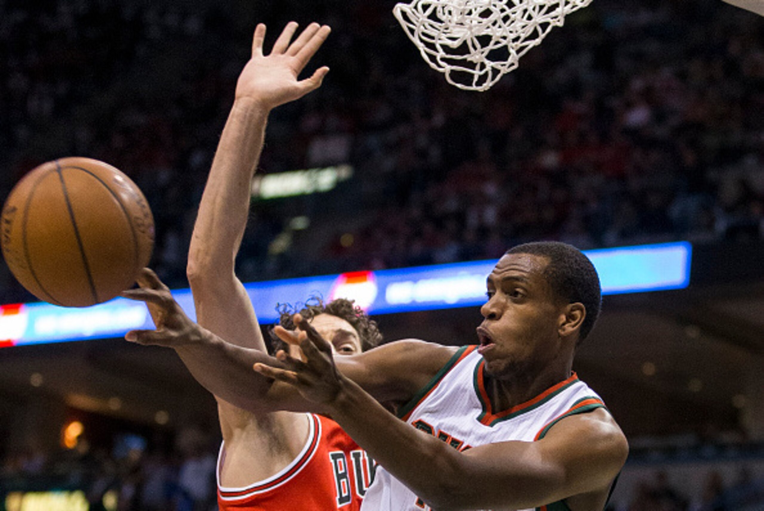 MILWAUKEE, WI - APRIL 23:  Guard Khris Middleton #22 of the Milwaukee Bucks passes the ball against the Chicago Bulls in the second quarter of game three of the first round of the 2015 NBA Playoffs April 23, 2015 at the Bradley Center in Milwaukee, Wiscon