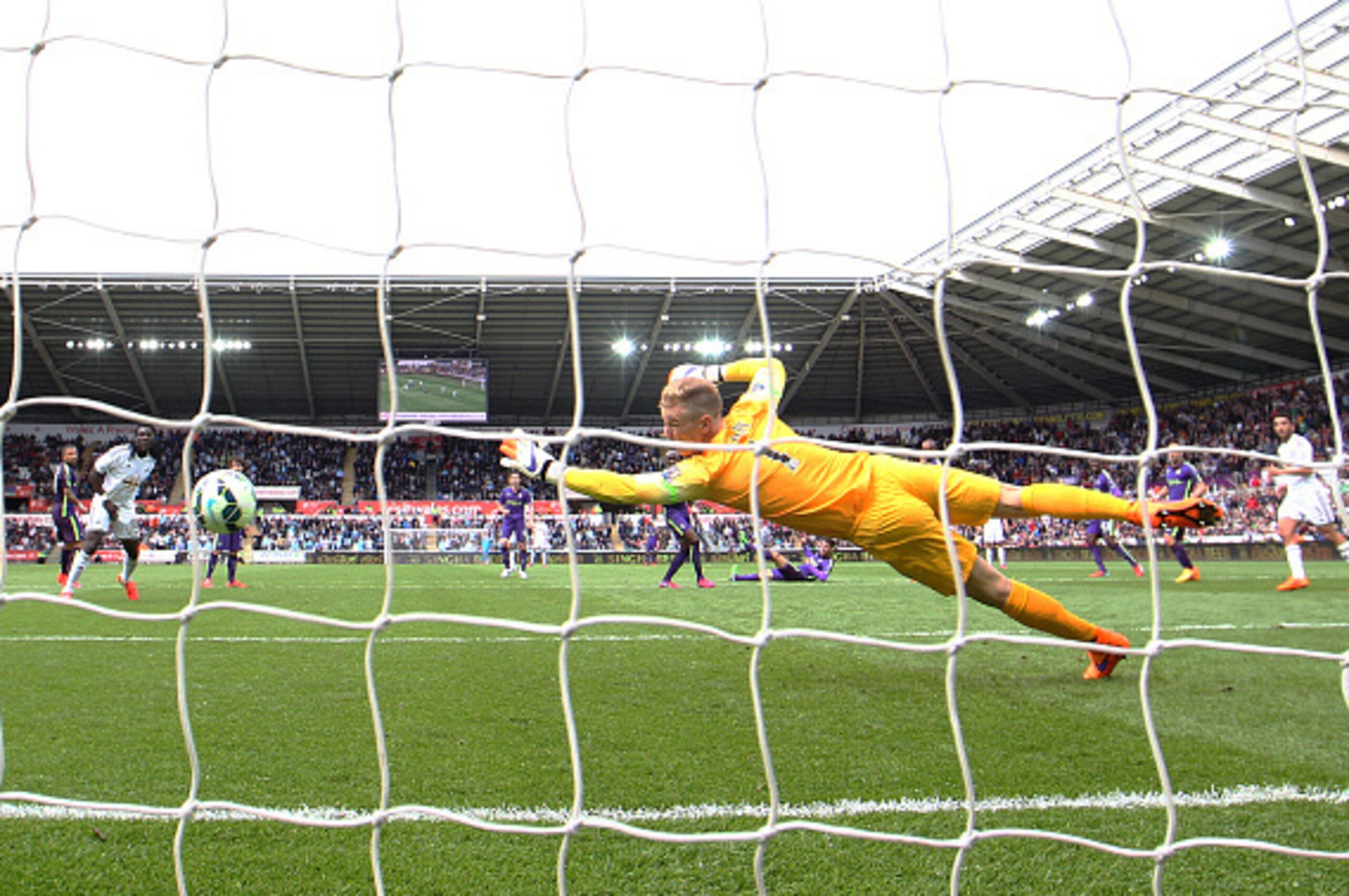 SWANSEA, WALES - MAY 17: Gylfi Sigurdsson (not seen) of Swansea City scores a goal past the outstretched Joe Hart of Manchester City during the Barclays Premier League match between Swansea and Manchester City at the Liberty Stadium on May 17, 2015 in Sw SWANSEA, WALES - MAY 17: Gylfi Sigurdsson (not seen) of Swansea City scores a goal past the outstretched Joe Hart of Manchester City during the Barclays Premier League match between Swansea and Manchester City at the Liberty Stadium on May 17, 2015 in Sw