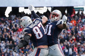 FOXBORO, MA - OCTOBER 26:  Rob Gronkowski #87 reacts with Tim Wright #81 of the New England Patriots after catching a touchdown pass during the second quarter against the Chicago Bears at Gillette Stadium on October 26, 2014 in Foxboro, Massachusetts.  (P