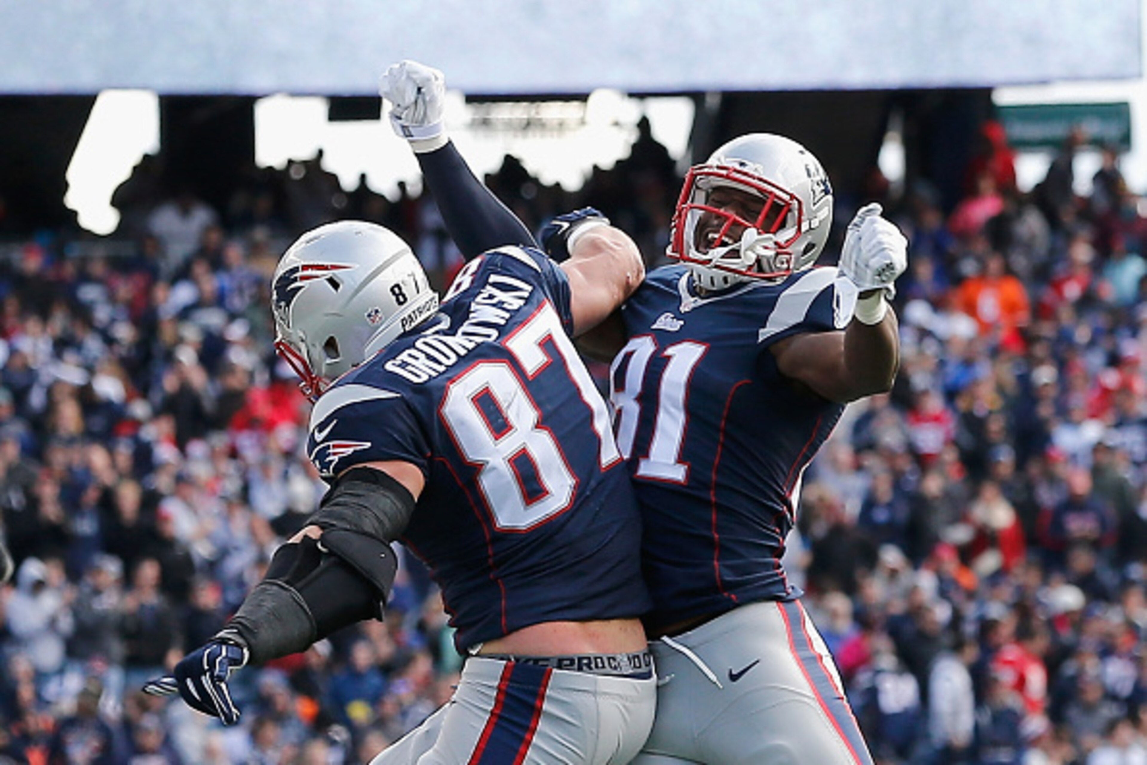 FOXBORO, MA - OCTOBER 26:  Rob Gronkowski #87 reacts with Tim Wright #81 of the New England Patriots after catching a touchdown pass during the second quarter against the Chicago Bears at Gillette Stadium on October 26, 2014 in Foxboro, Massachusetts.  (P
