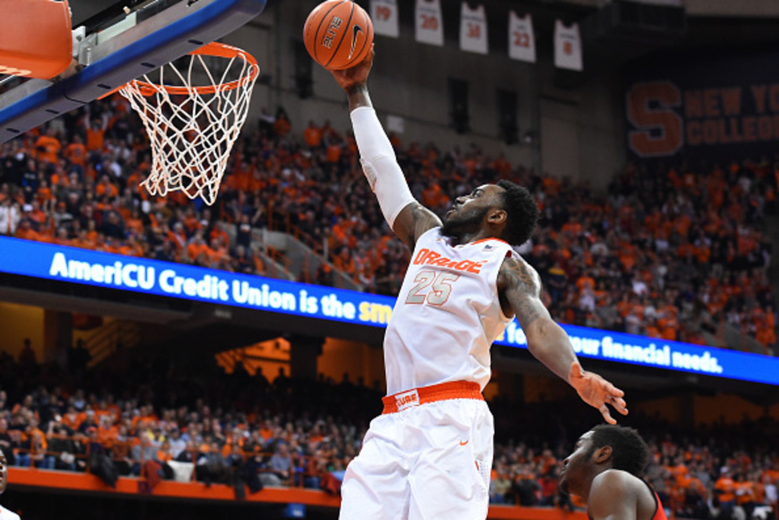 SYRACUSE, NY - FEBRUARY 18: Rakeem Christmas #25 of the Syracuse Orange drives to the basket against the Louisville Cardinals during the second half at the Carrier Dome on February 18, 2015 in Syracuse, New York. Syracuse defeated Louisville 69-59. (Photo