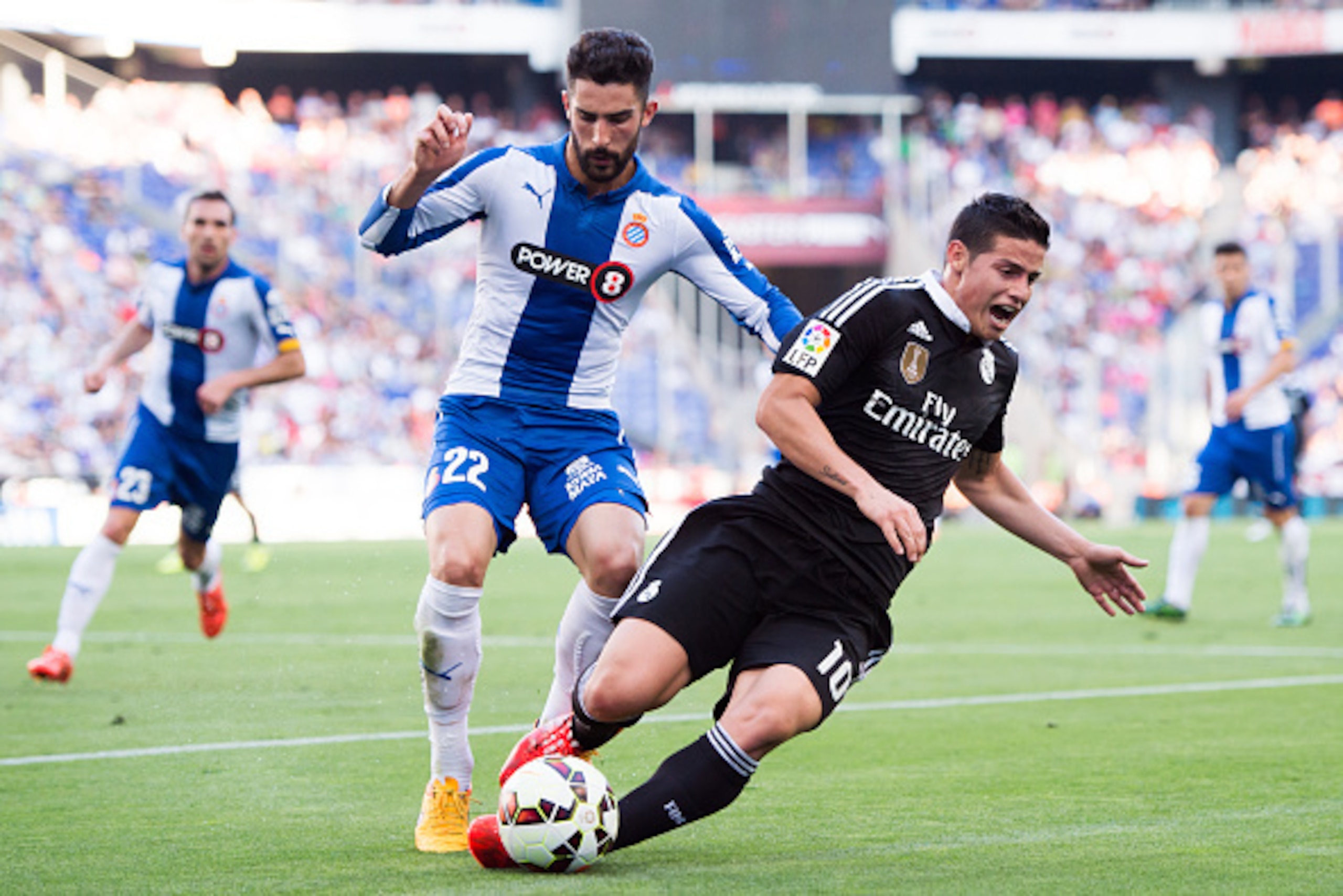 BARCELONA, SPAIN - MAY 17:  James Rodriguez of Real Madrid CF is brought down by Alvaro Gonzalez of RCD Espanyol during the La Liga match between RCD Espanyol and Real Madrid CF at Cornella-El Prat Stadium on May 17, 2015 in Barcelona, Spain.  (Photo by A