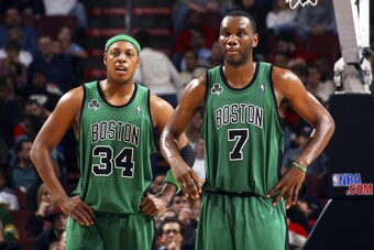 PHILADELPHIA - DECEMBER 13:  Paul Pierce #34 and Al Jefferson #7 of the Boston Celtics wait for play to start during the game against the Philadelphia 76ers on December 13, 2006 at the Wachovia Center in Philadelphia, Pennsylvania. NOTE TO USER: User expr