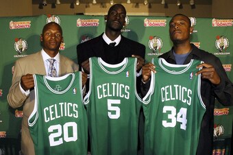 BOSTON - JULY 31: (L-R) Boston Celtics Ray Allen, Kevin Garnett and Paul Pierce hold their jerseys after their press conference on July 31, 2007 at the TD Banknorth Garden in Boston, Massachusetts.   NOTE TO USER: User expressly acknowledges and agrees th