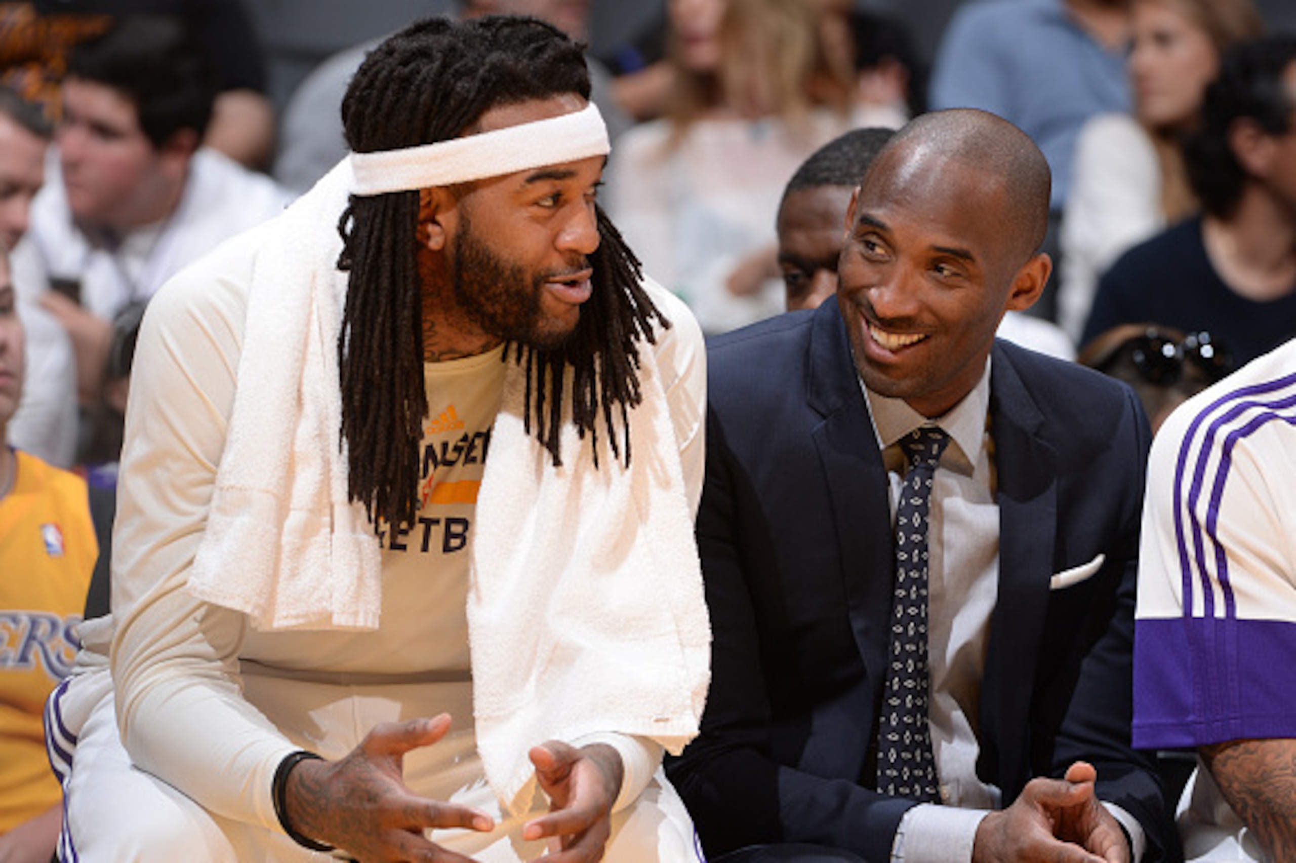 LOS ANGELES, CA - APRIL 12: Jordan Hill #27 and Kobe Bryant #24 of the Los Angeles Lakers sit on the sideline during a game against the Dallas Mavericks at STAPLES Center on April 12, 2015 in Los Angeles, California. NOTE TO USER: User expressly acknowled
