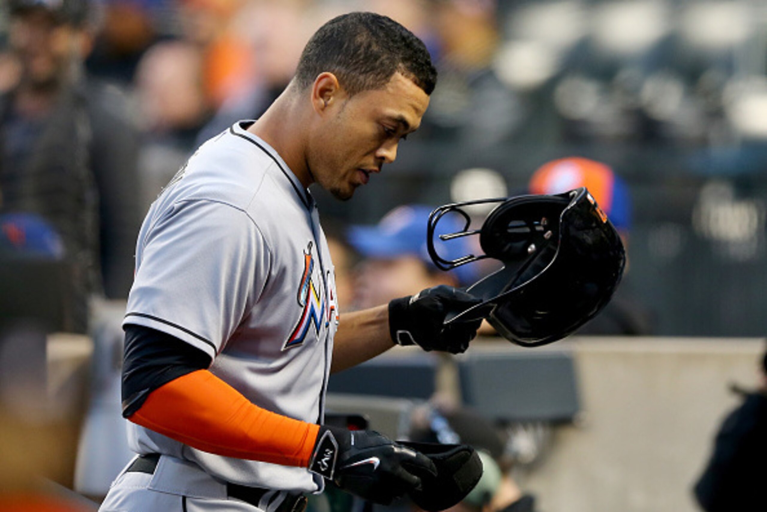NEW YORK, NY - APRIL 16:  Giancarlo Stanton #27 of the Miami Marlins heads into the dugout after hitting a two run homer in the first inning against the New York Mets on April 16, 2015 at Citi Field in the Flushing neighborhood of the Queens borough of Ne
