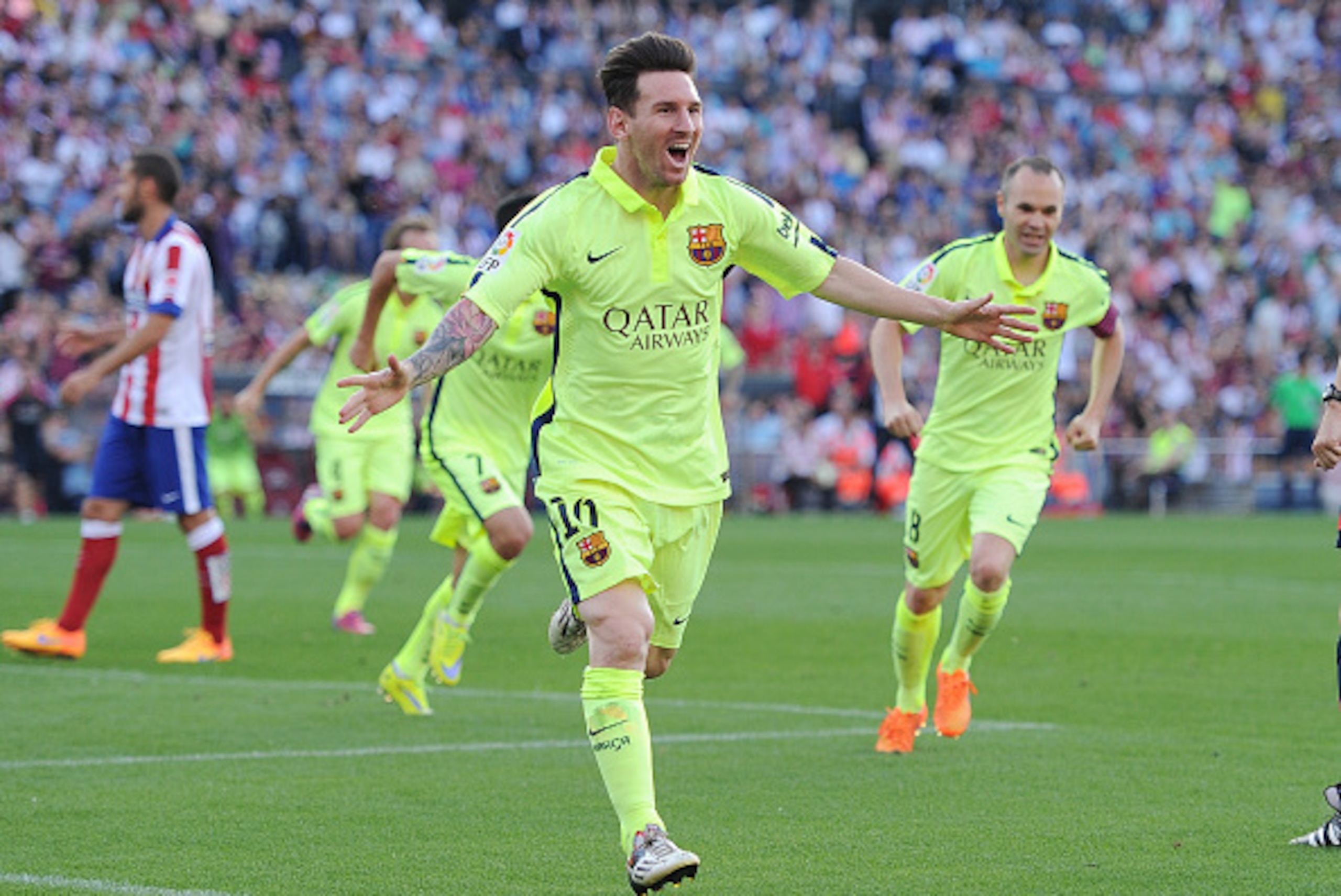 MADRID, SPAIN - MAY 17:  Lionel Messi of FC Barcelona celebrates after scoring his team's opening goal during the La Liga match between Club Atletico de Madrid and FC Barcelona at Vicente Calderon Stadium on May 17, 2015 in Madrid, Spain.  (Photo by Denis
