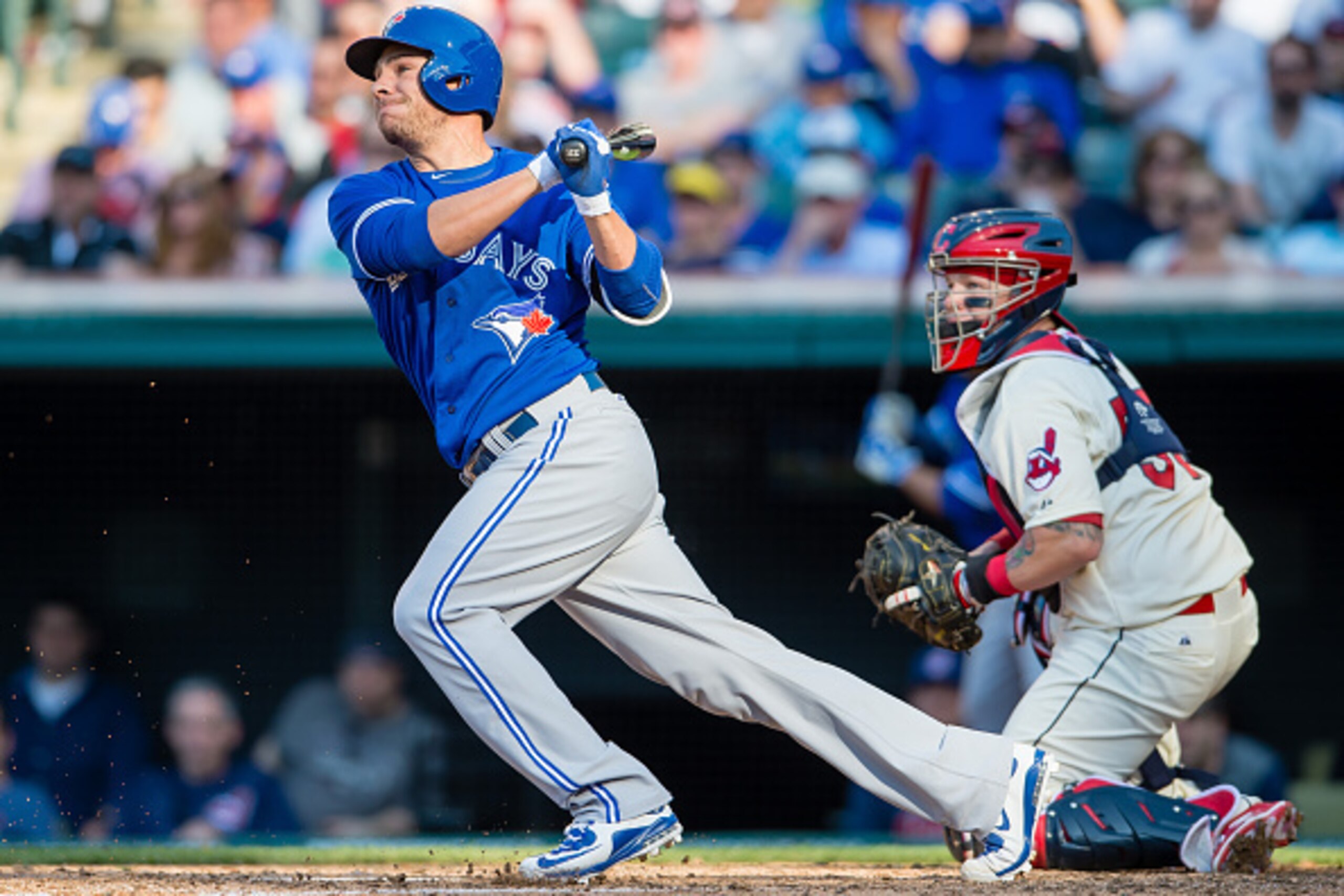 CLEVELAND, OH -  MAY 2: Danny Valencia #23 of the Toronto Blue Jays hits an RBI ground ball during the sixth inning against the Cleveland Indians at Progressive Field on May 2, 2015 in Cleveland, Ohio.  (Photo by Jason Miller/Getty Images)