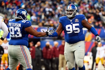EAST RUTHERFORD, NJ - DECEMBER 14:   Mike Patterson #93 and  Johnathan Hankins #95 of the New York Giants celebrate a stop against the Washington Redskins during their game at MetLife Stadium on December 14, 2014 in East Rutherford, New Jersey.  (Photo by