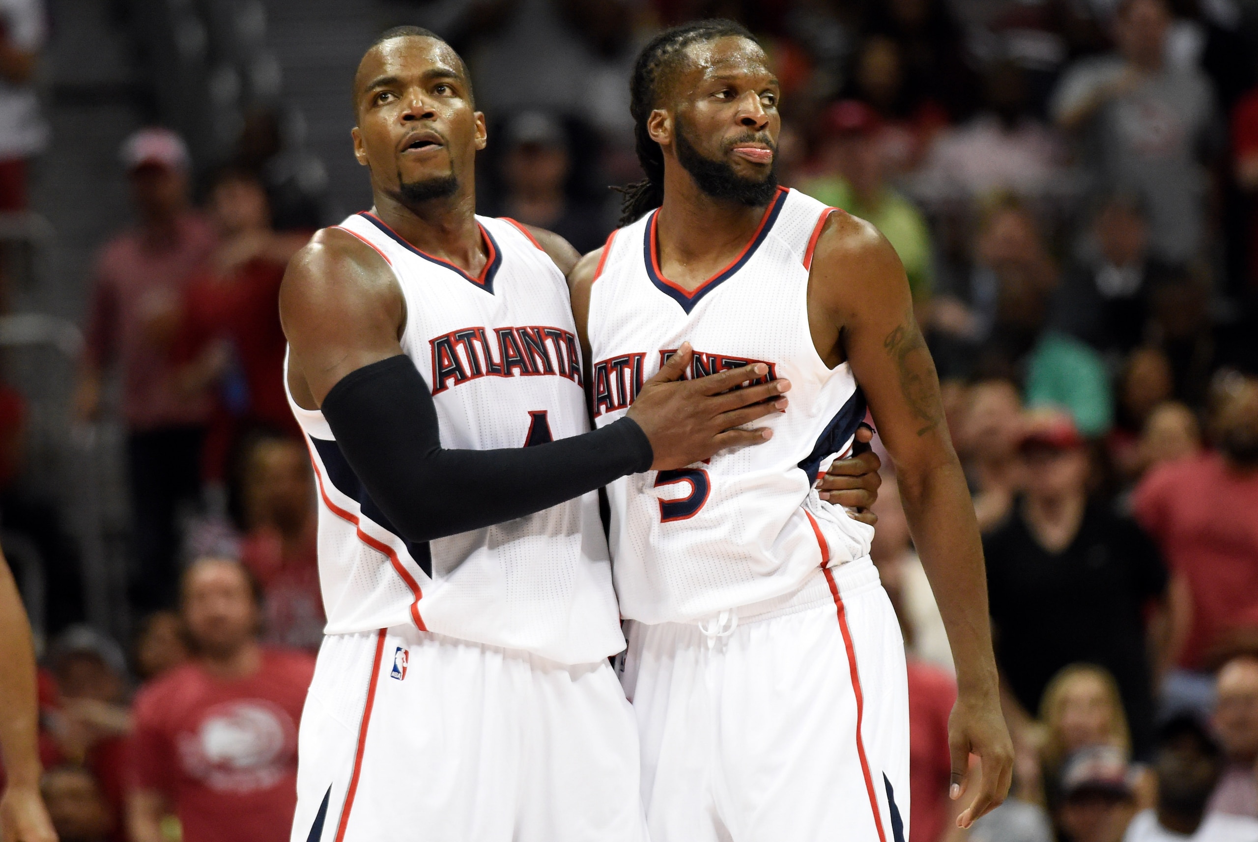 May 13, 2015; Atlanta, GA, USA; Atlanta Hawks forward Paul Millsap (4) restrains forward DeMarre Carroll (5) after an altercation with Washington Wizards forward Paul Pierce (not shown) during the second half in game five of the second round of the NBA Pl