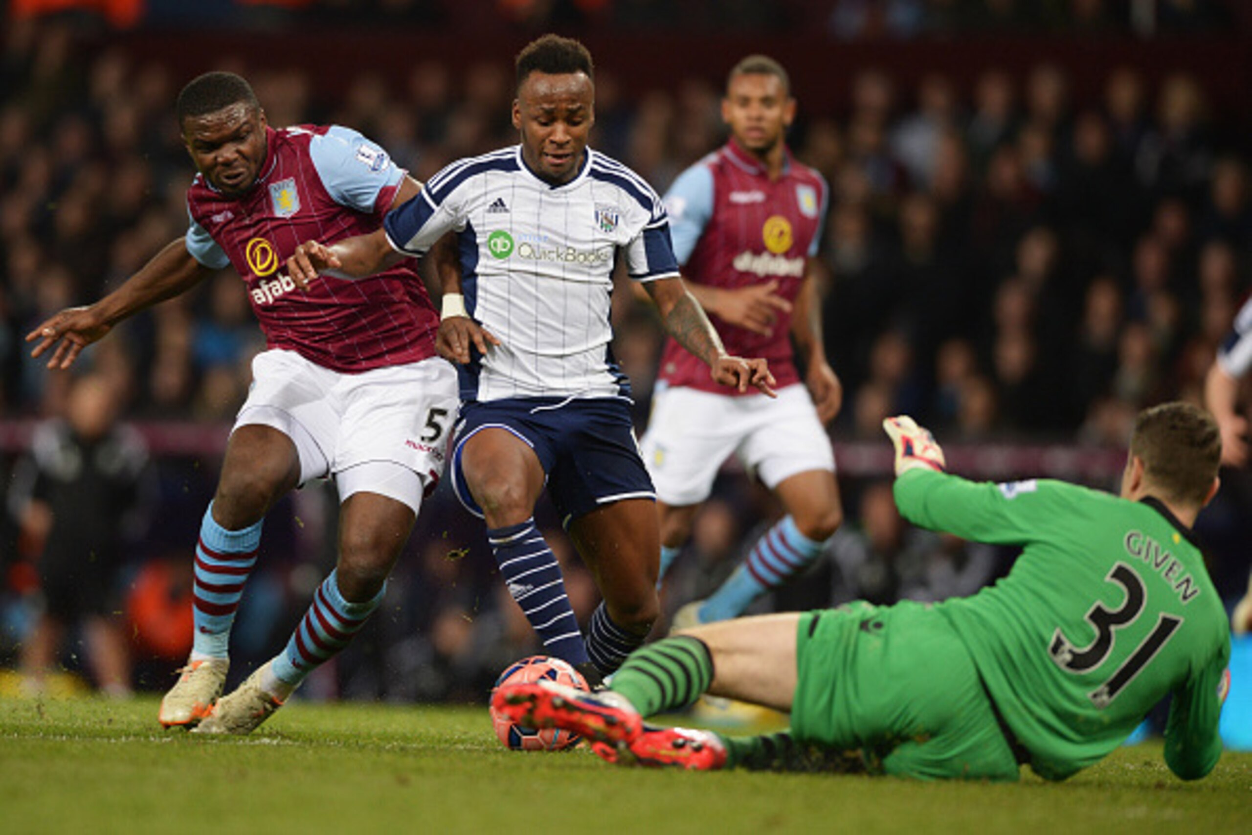 BIRMINGHAM, ENGLAND - MARCH 07: Saido Berahino of West Bromwich Albion is foiled by goalkeeper Shay Given and Jores Okore of Aston Villa during the FA Cup Quarter Final match between Aston Villa and West Bromwich Albion at Villa Park on March 7, 2015 in BIRMINGHAM, ENGLAND - MARCH 07: Saido Berahino of West Bromwich Albion is foiled by goalkeeper Shay Given and Jores Okore of Aston Villa during the FA Cup Quarter Final match between Aston Villa and West Bromwich Albion at Villa Park on March 7, 2015 in