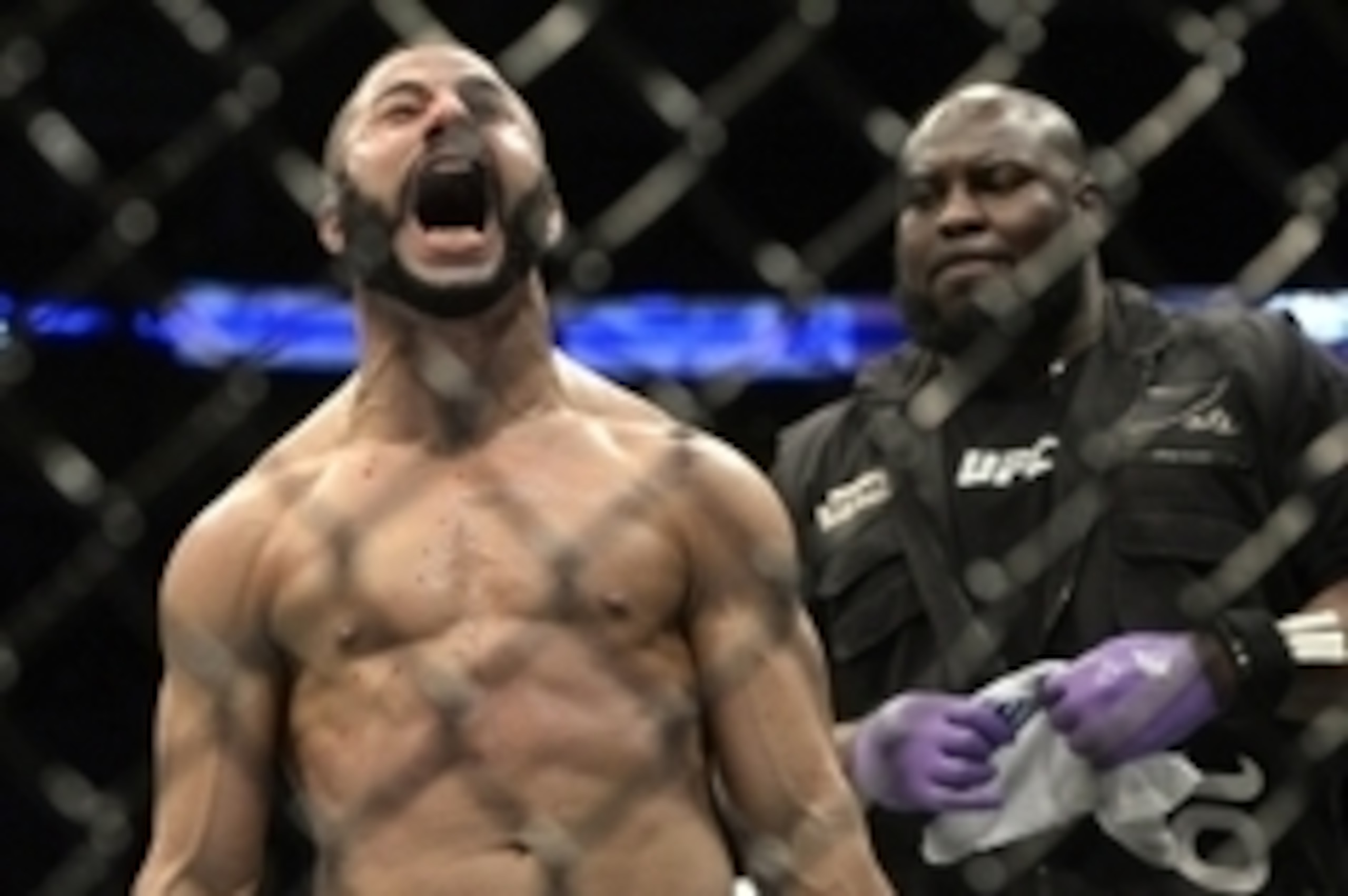 Apr 25, 2015; Montreal, Quebec, CAN; John Makdessi (red) reacts after his fight against Shane Campbell (blue) (not pictured) during their catchweight bout during UFC 186 at Bell Centre. Mandatory Credit: Eric Bolte-USA TODAY Sports