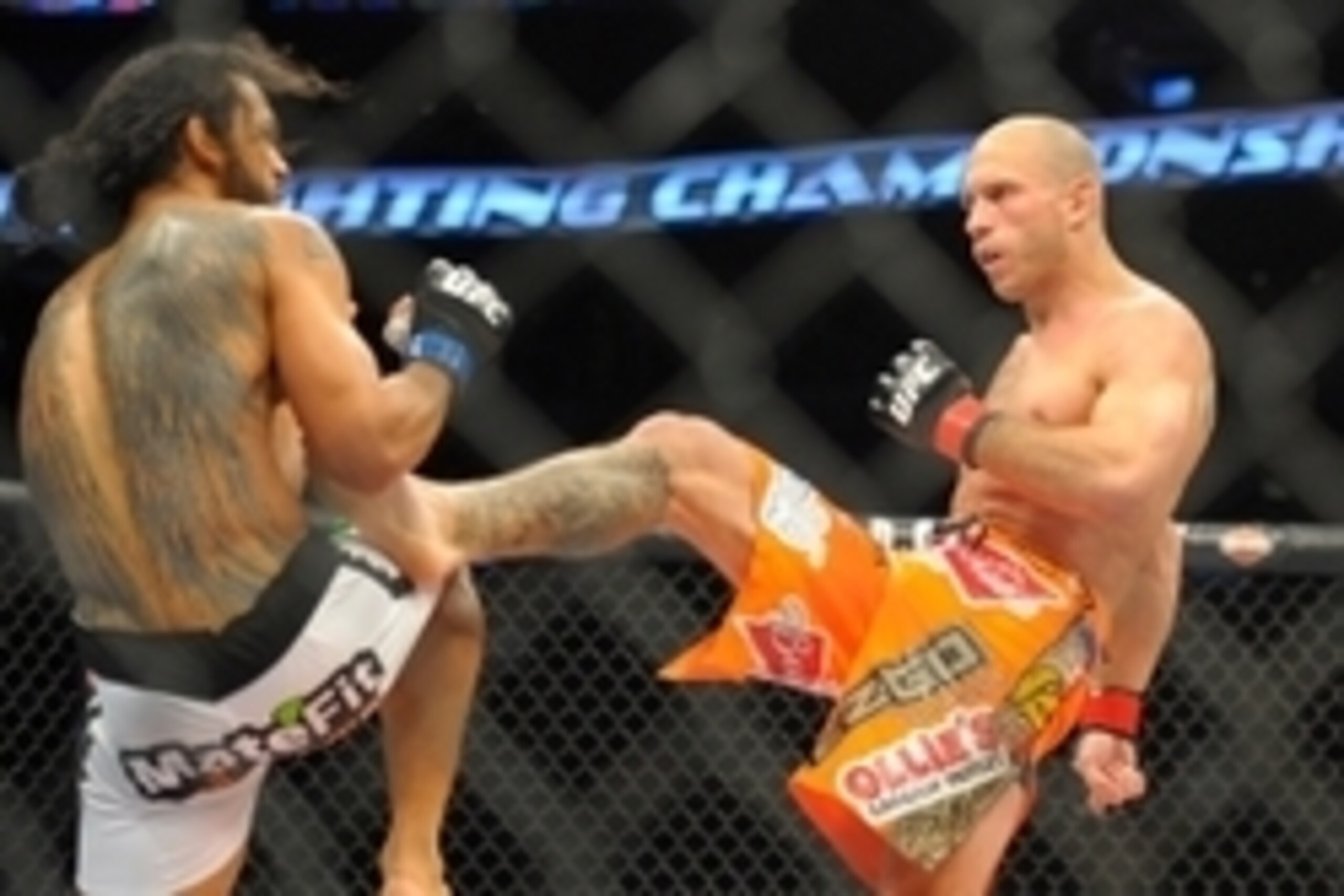 Jan 18, 2015; Boston, MA, USA; Donald Cerrone (red) and Benson Henderson (blue) compete during a lightweight bout at UFC Fight Night at TD Garden. Mandatory Credit: Bob DeChiara-USA TODAY Sports