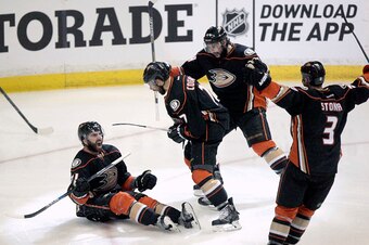 ANAHEIM, CA - MAY 17:  Kyle Palmieri #21, Andrew Cogliano #7, Nate Thompson #44, and Clayton Stoner #3 of the Anaheim Ducks celebrate after scoring a goal against the Chicago Blackhawks during Game One of the Western Conference Finals during the 2015 NHL 