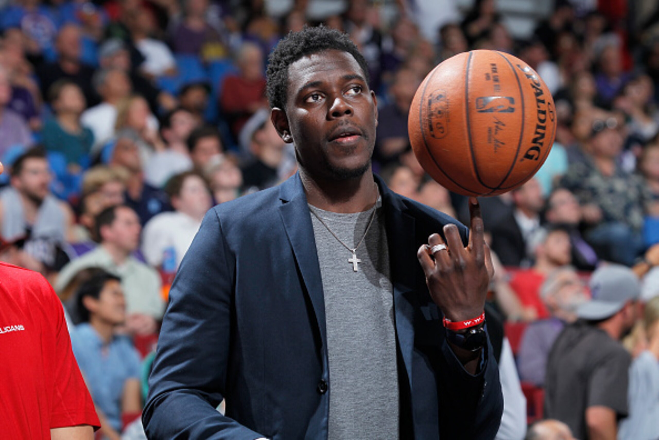 SACRAMENTO, CA - APRIL 3: Jrue Holiday #11 of the New Orleans Pelicans inactive against the Sacramento Kings on April 3, 2015 at Sleep Train Arena in Sacramento, California. NOTE TO USER: User expressly acknowledges and agrees that, by downloading and or 