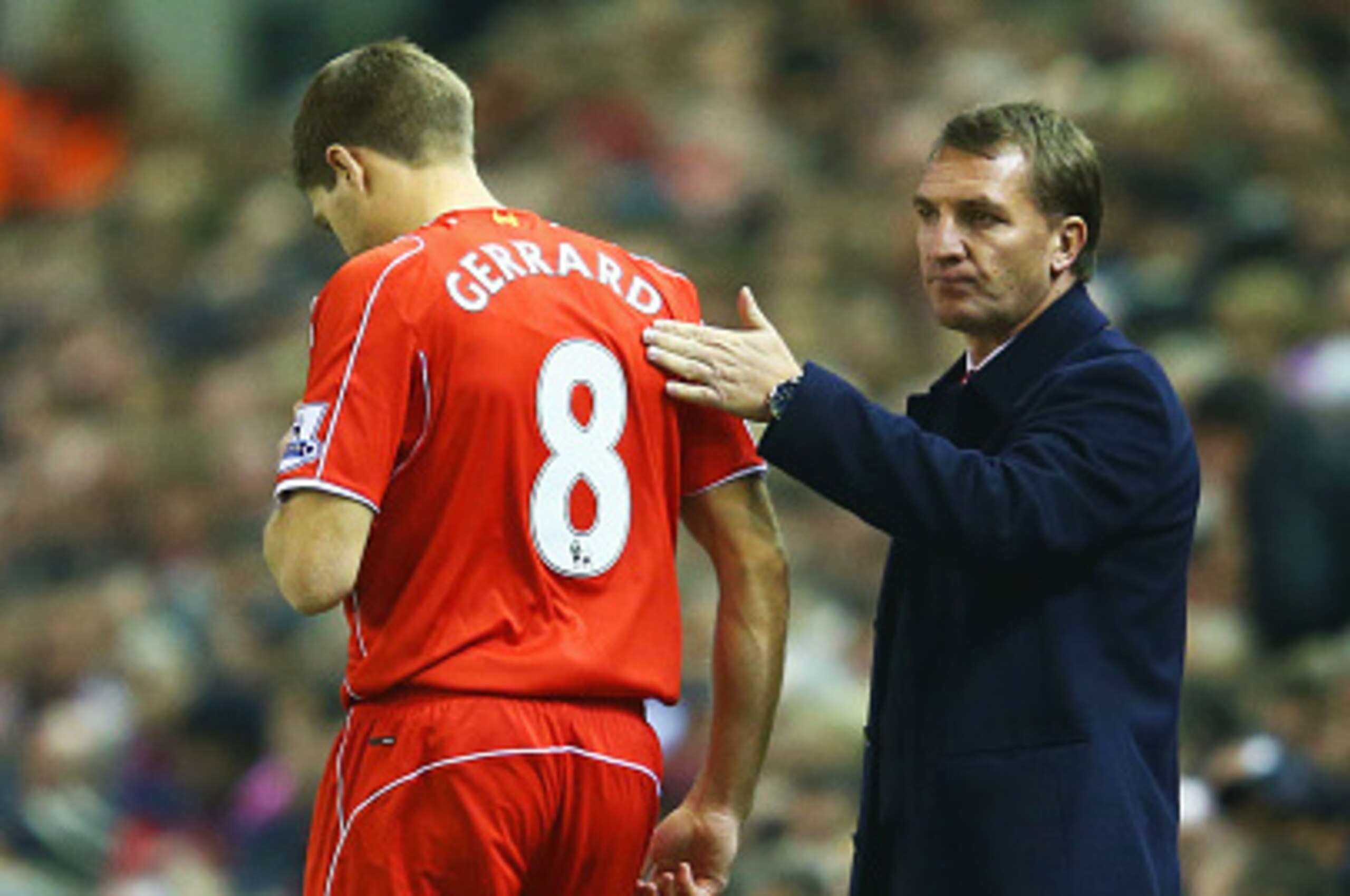 LIVERPOOL, ENGLAND - NOVEMBER 29:  Steven Gerrard of Liverpool prepares to come onto the pitch as a substitute as Brendan Rodgers manager of Liverpool looks on during the Barclays Premier League match between Liverpool and Stoke City at Anfield on Novembe
