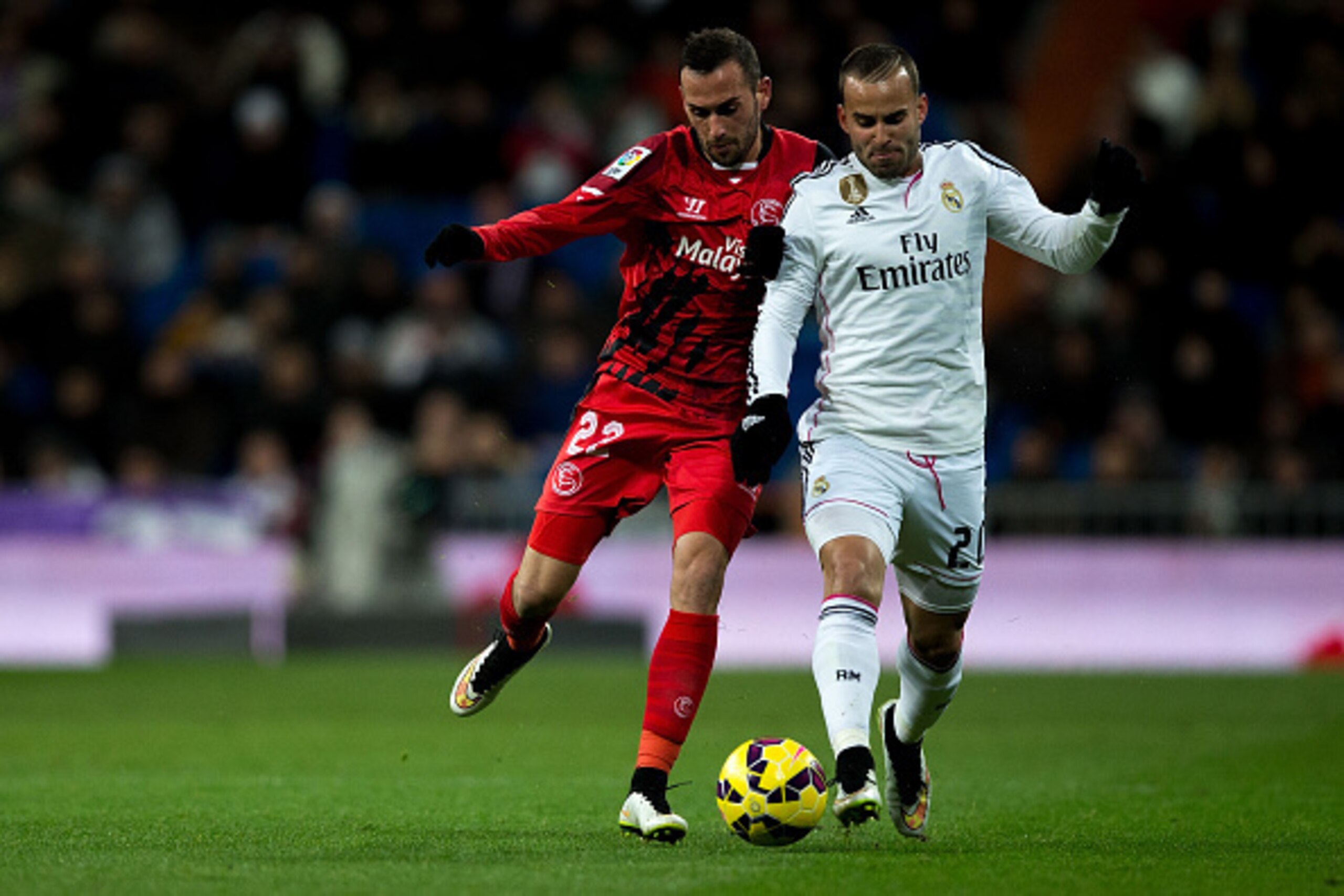 MADRID, SPAIN - FEBRUARY 04: Jese Rodriguez (R) of Real Madrid CF competes for the ball with Alex Vidal (L) of Sevilla FC during the La Liga match between Real Madrid CF and Sevilla FC at Estadio Santiago Bernabeu on February 4, 2015 in Madrid, Spain. (P MADRID, SPAIN - FEBRUARY 04: Jese Rodriguez (R) of Real Madrid CF competes for the ball with Alex Vidal (L) of Sevilla FC during the La Liga match between Real Madrid CF and Sevilla FC at Estadio Santiago Bernabeu on February 4, 2015 in Madrid, Spain. (P