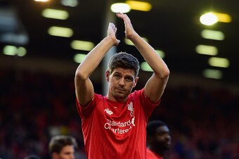 LIVERPOOL, ENGLAND - MAY 16:  Steven Gerrard of Liverpool applauds the fans as he walks a lap of honour after his final game at Anfield during the Barclays Premier League match between Liverpool and Crystal Palace at Anfield on May 16, 2015 in Liverpool, 