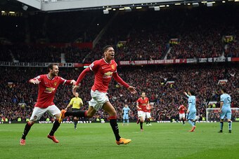 MANCHESTER, ENGLAND - APRIL 12: Chris Smalling of Manchester United celebrates as he scores their fourth goal during the Barclays Premier League match between Manchester United and Manchester City at Old Trafford on April 12, 2015 in Manchester, England. 