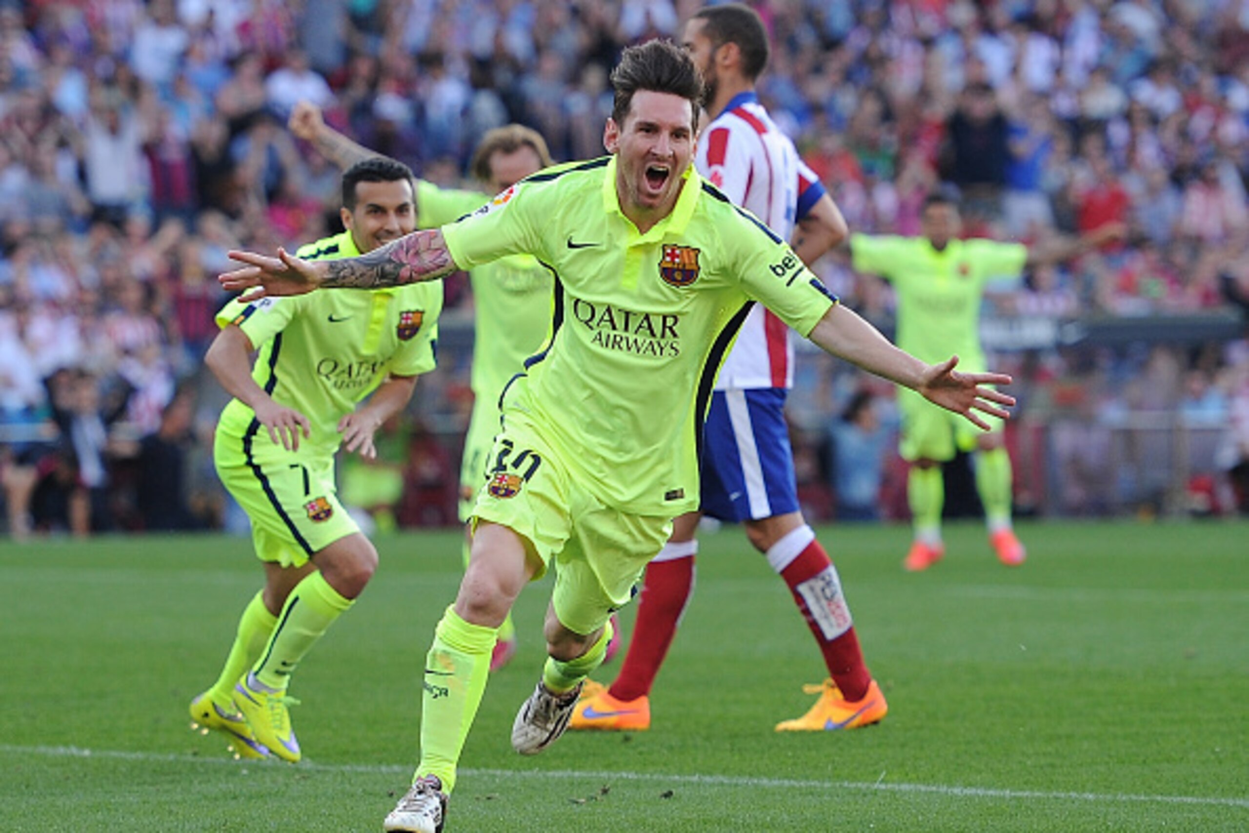 MADRID, SPAIN - MAY 17:  Lionel Messi of FC Barcelona celebrates after scoring his team's opening goal during the La Liga match between Club Atletico de Madrid and FC Barcelona at Vicente Calderon Stadium on May 17, 2015 in Madrid, Spain.  (Photo by Denis