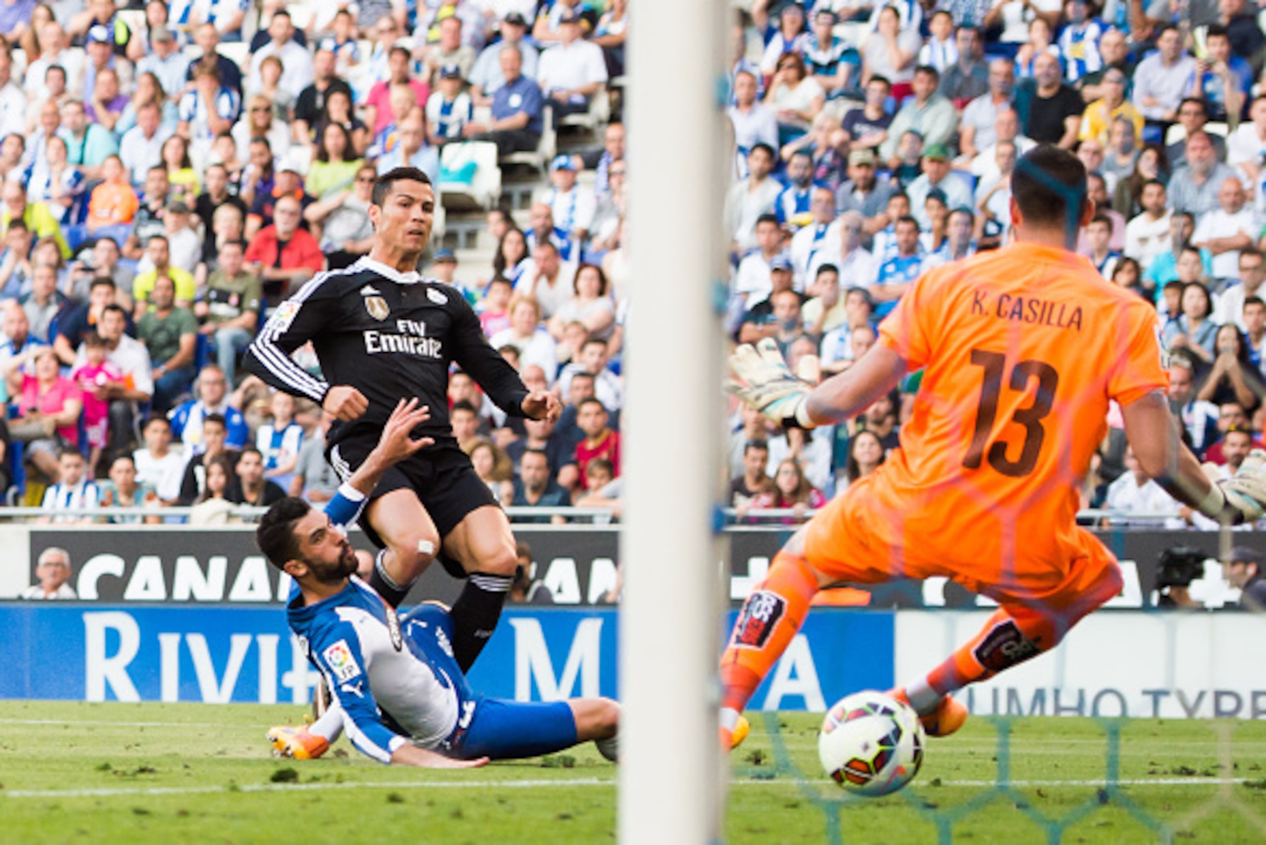 BARCELONA, SPAIN - MAY 17: Cristiano Ronaldo of Real Madrid CF scores the opening goal during the La Liga match between RCD Espanyol and Real Madrid CF at Cornella-El Prat Stadium on May 17, 2015 in Barcelona, Spain. (Photo by Alex Caparros/Getty Images)