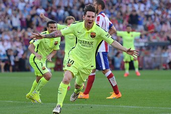 MADRID, SPAIN - MAY 17:  Lionel Messi of FC Barcelona celebrates after scoring his team's opening goal during the La Liga match between Club Atletico de Madrid and FC Barcelona at Vicente Calderon Stadium on May 17, 2015 in Madrid, Spain.  (Photo by Denis