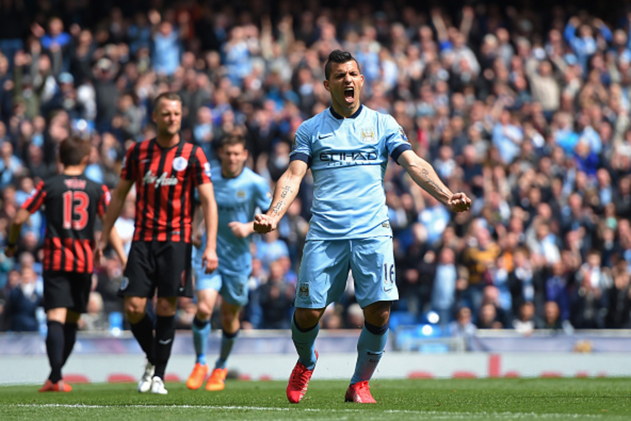 MANCHESTER, ENGLAND - MAY 10:  Sergio Aguero of Manchester City celebrates after scoring his team's fourth goal from the penalty spot during the Barclays Premier League match between Manchester City and Queens Park Rangers at the Etihad Stadium on May 10,
