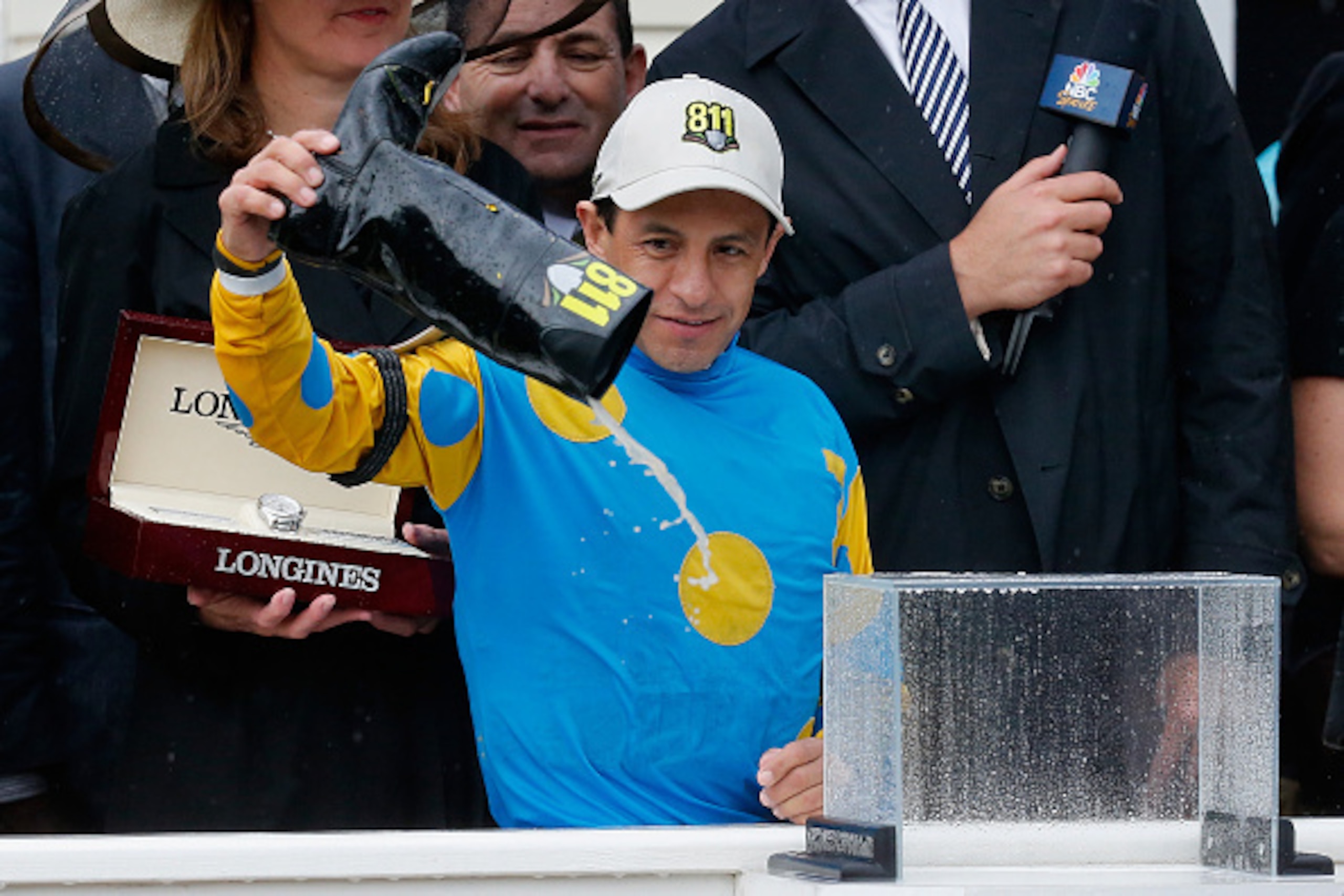 BALTIMORE, MD - MAY 16: Jockey Victor Espinoza pours water out of his boot in the winners circle after riding American Pharoah to win the 140th running of the Preakness Stakes at Pimlico Race Course on May 16, 2015 in Baltimore, Maryland. (Photo by Rob BALTIMORE, MD - MAY 16: Jockey Victor Espinoza pours water out of his boot in the winners circle after riding American Pharoah to win the 140th running of the Preakness Stakes at Pimlico Race Course on May 16, 2015 in Baltimore, Maryland. (Photo by Rob