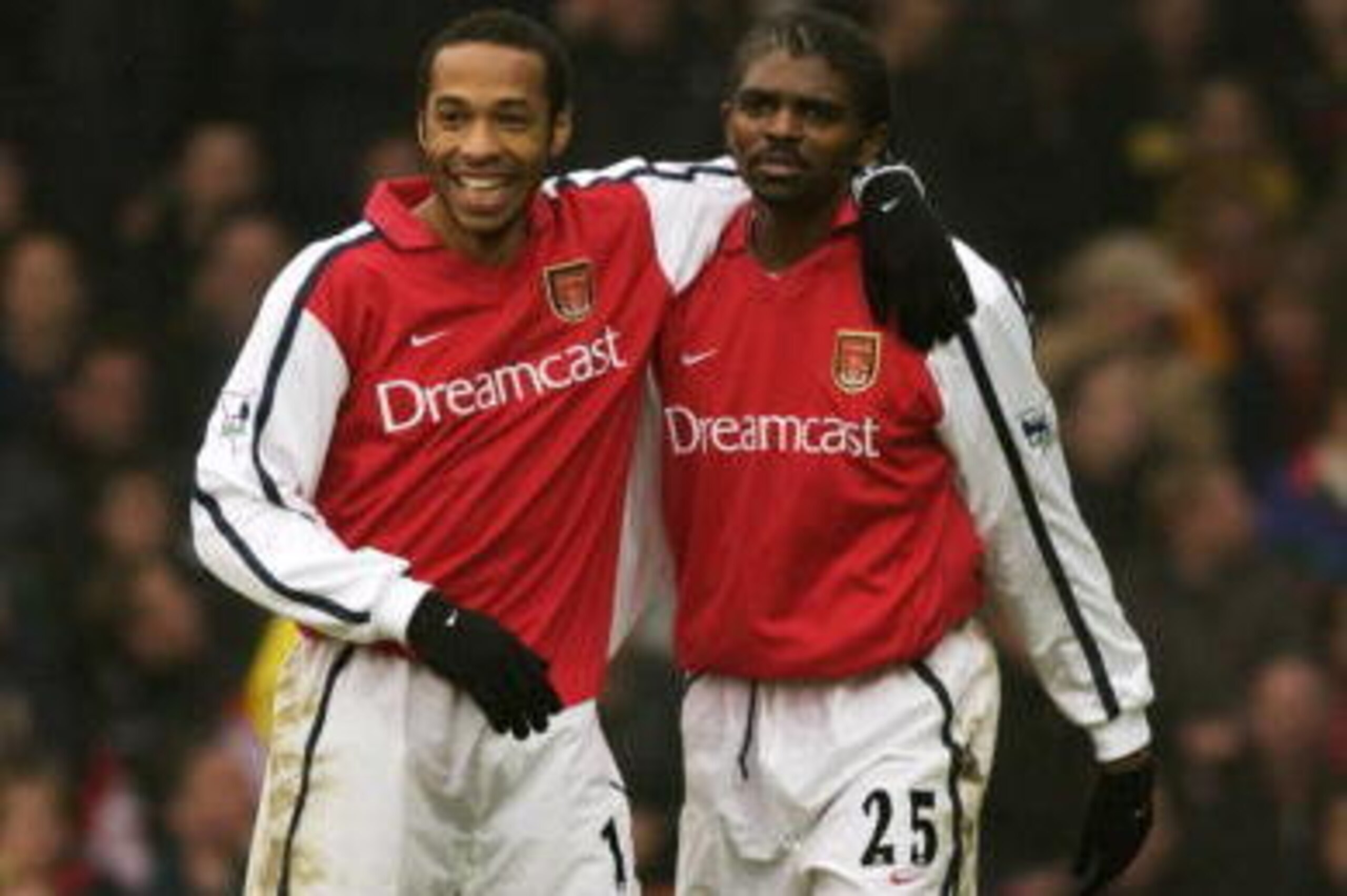 5 Jan 2002:  Thierry Henry (left) and Nwankwo Kanu (right) of Arsenal celebrate during the AXA sponsored FA Cup third round match against Watford played at Vicarage Road, in Watford, England. Arsenal won the match 4-2. DIGITAL IMAGE. Mandatory Credit: Stu