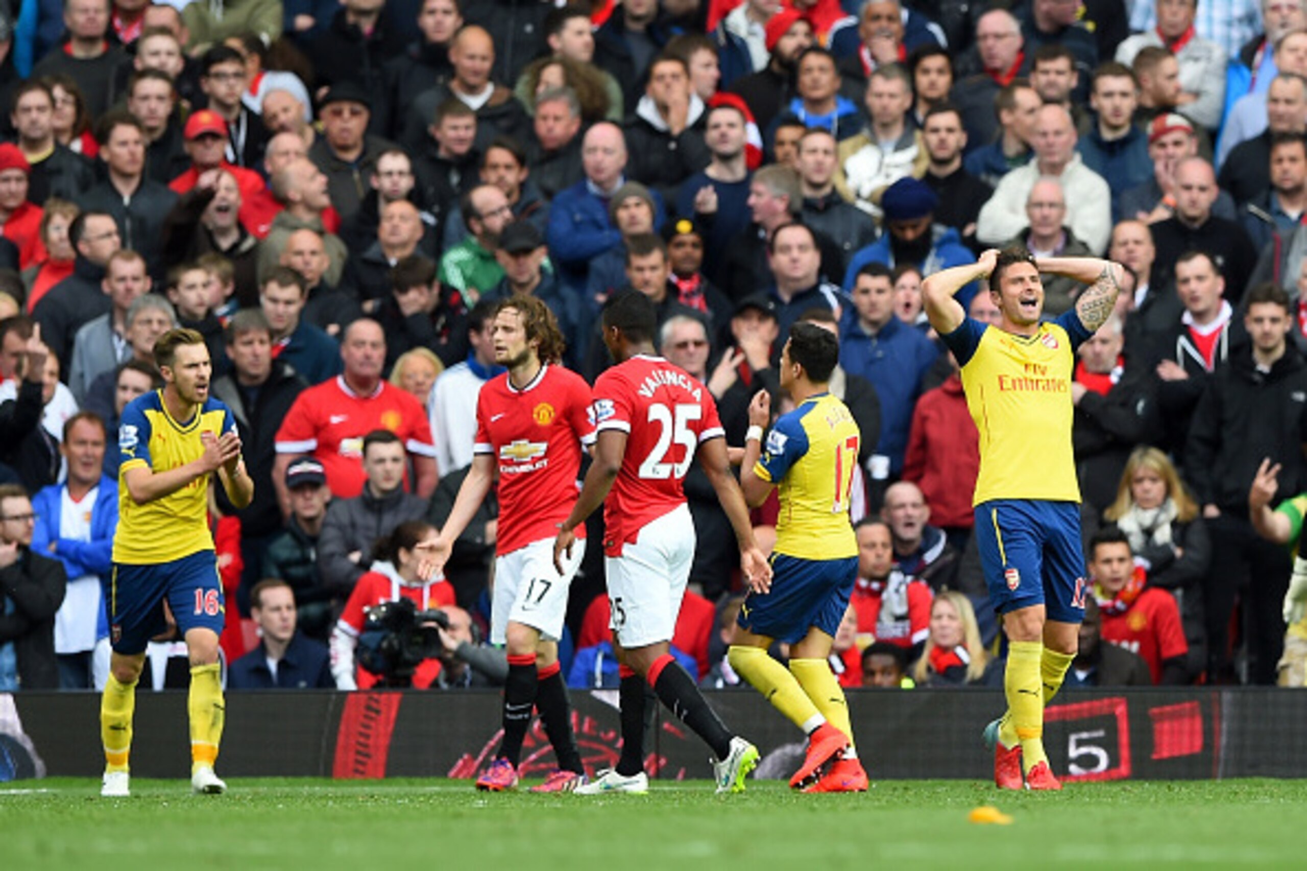 MANCHESTER, ENGLAND - MAY 17:  Olivier Giroud of Arsenal reacts after a missed chance during the Barclays Premier League match between Manchester United and Arsenal at Old Trafford on May 17, 2015 in Manchester, England.  (Photo by Shaun Botterill/Getty I