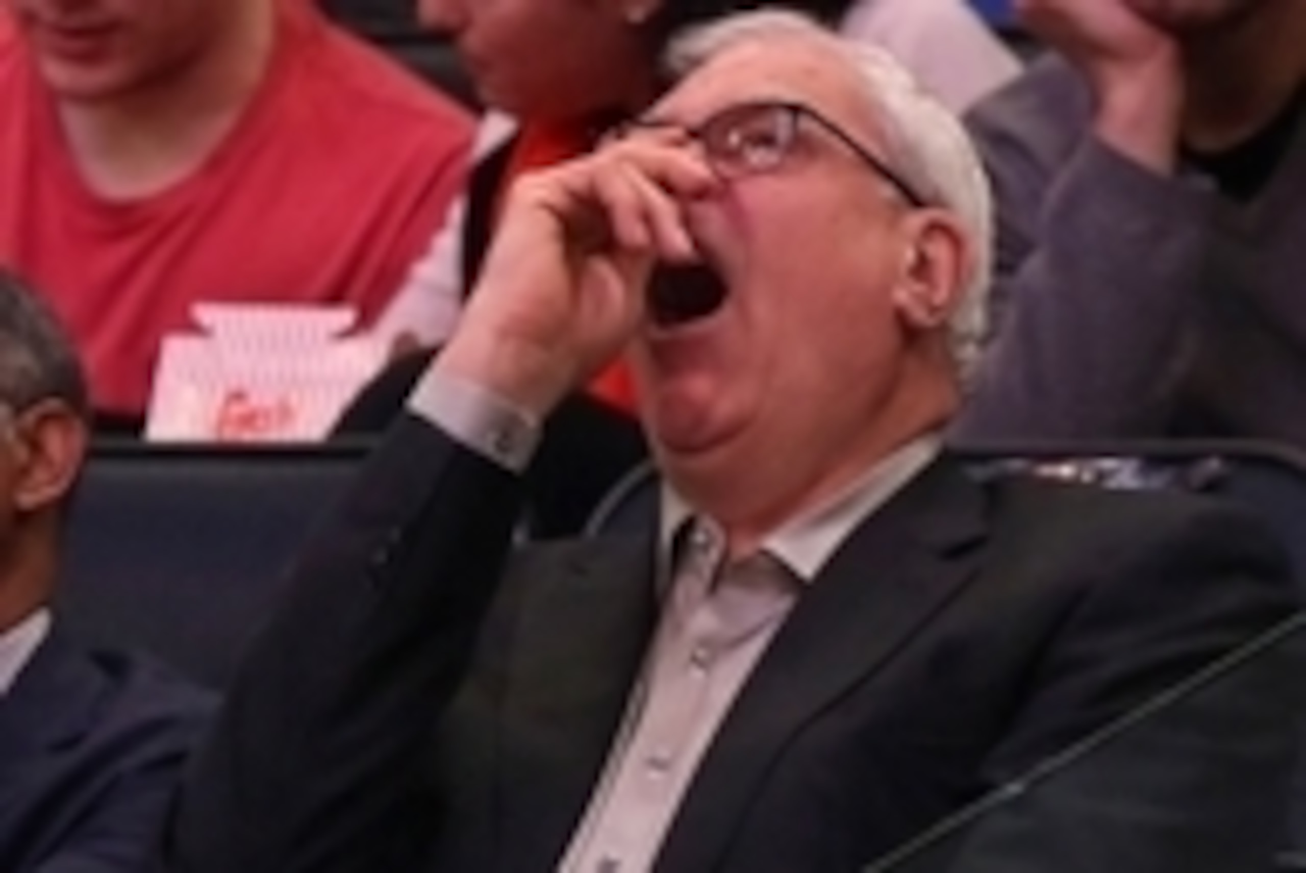 Apr 5, 2015; New York, NY, USA; New York Knicks general manager Phil Jackson yawns against the Philadelphia 76ers during the second half at Madison Square Garden. The Knicks defeated the 76ers 101 - 91. Mandatory Credit: Adam Hunger-USA TODAY Sports