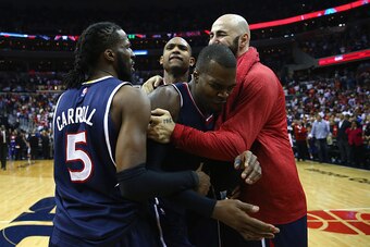 WASHINGTON, DC - MAY 15:  Paul Millsap #4 of the Atlanta Hawks, DeMarre Carroll #5, Pero Antic #6 and Al Horford #15 celebrate their 94-91 win over the Washington Wizards at Verizon Center on May 15, 2015 in Washington, DC. (Photo by Maddie Meyer/Getty Im