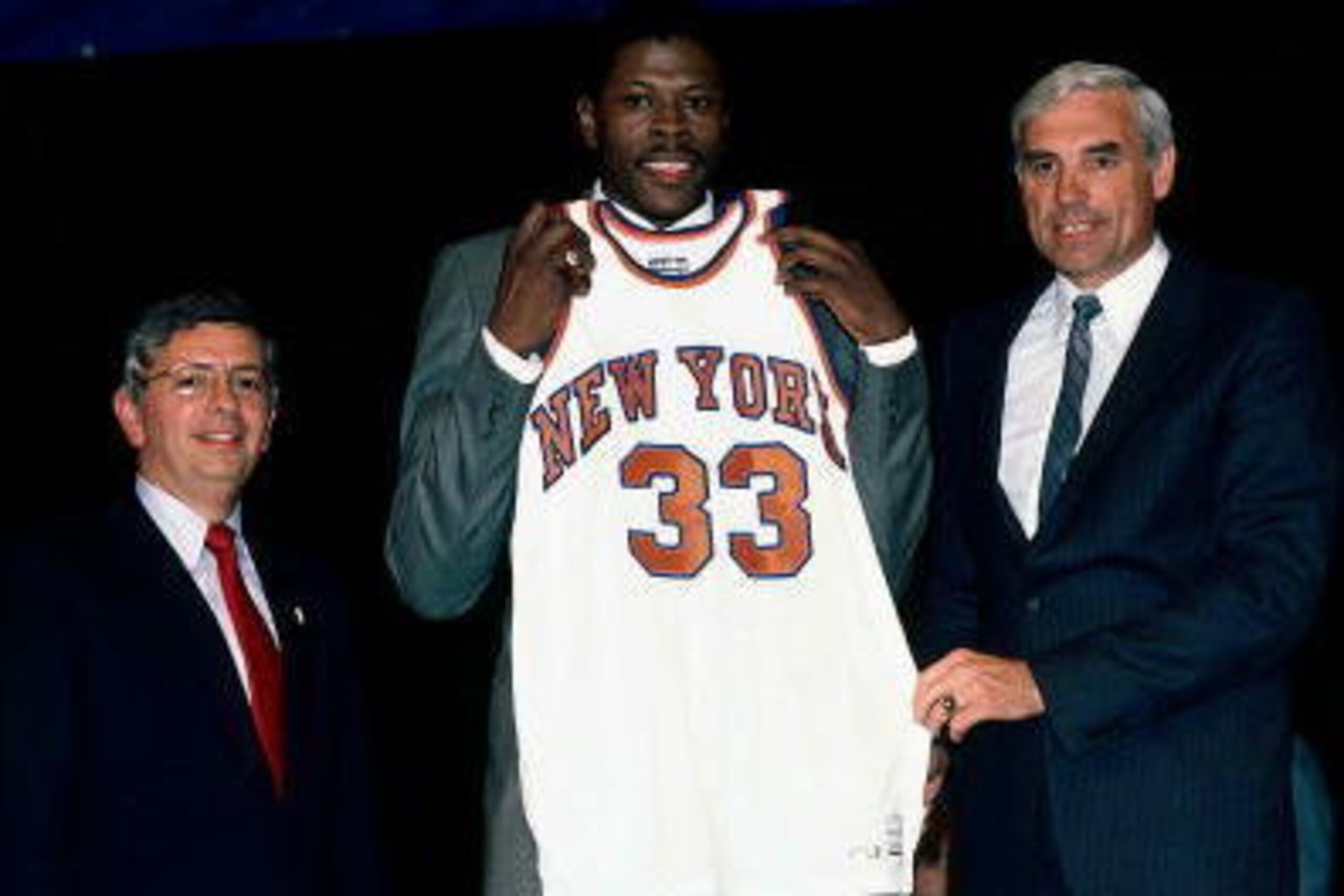 NEW YORK - 1985:  Patrick Ewing #33 of the New York Knicks poses for a portrait with the Knicks General Manager Dave DeBusschere and NBA Commissioner David Stern during the 1985 NBA Draft at The Felt forum in New York, New York. NOTE TO USER: User express