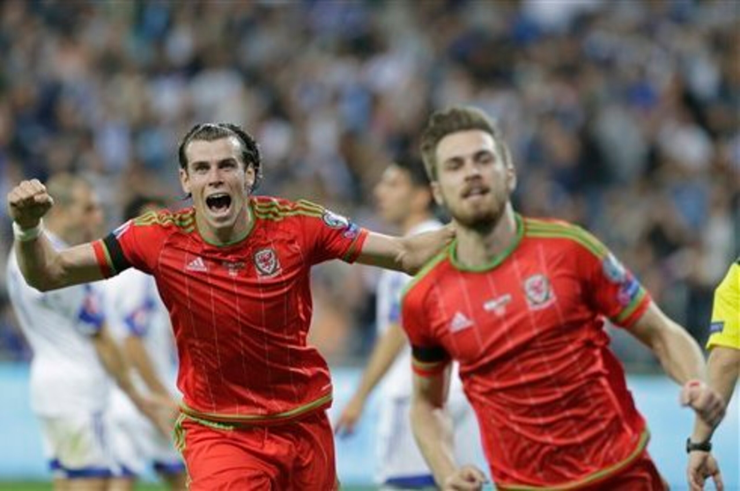 Bale celebrates Aaron Ramsey opening the scoring for Wales away at Israel in March. He added two goals himself to complete a 3-0 win.