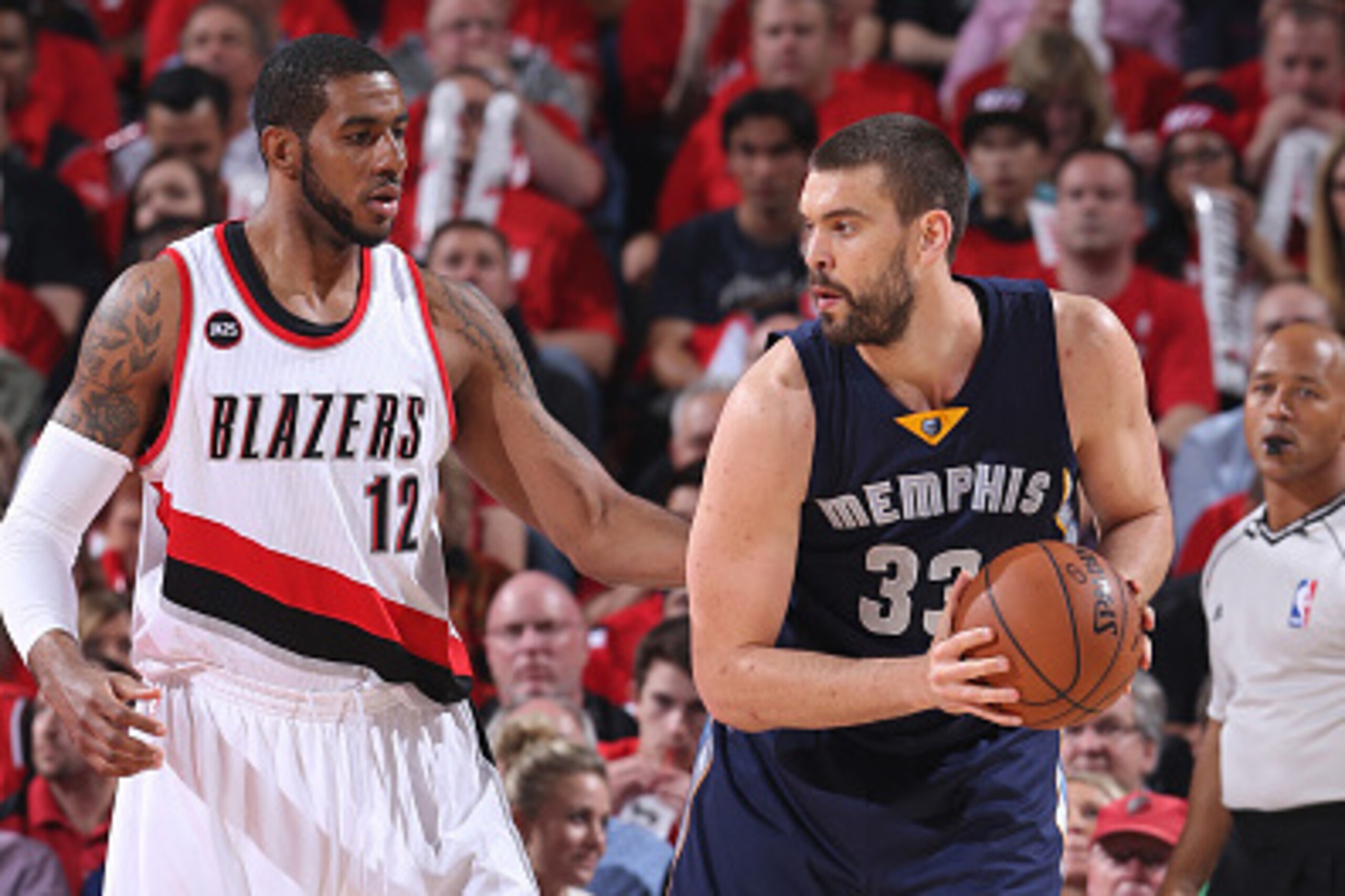 PORTLAND, OR - APRIL 27:  Marc Gasol #33 of the Memphis Grizzlies looks to drive to the basket against LaMarcus Aldridge #12 of the Portland Trail Blazers in Game Four of the Western Conference Quarterfinals during the 2015 NBA Playoffs on April 27, 2015 