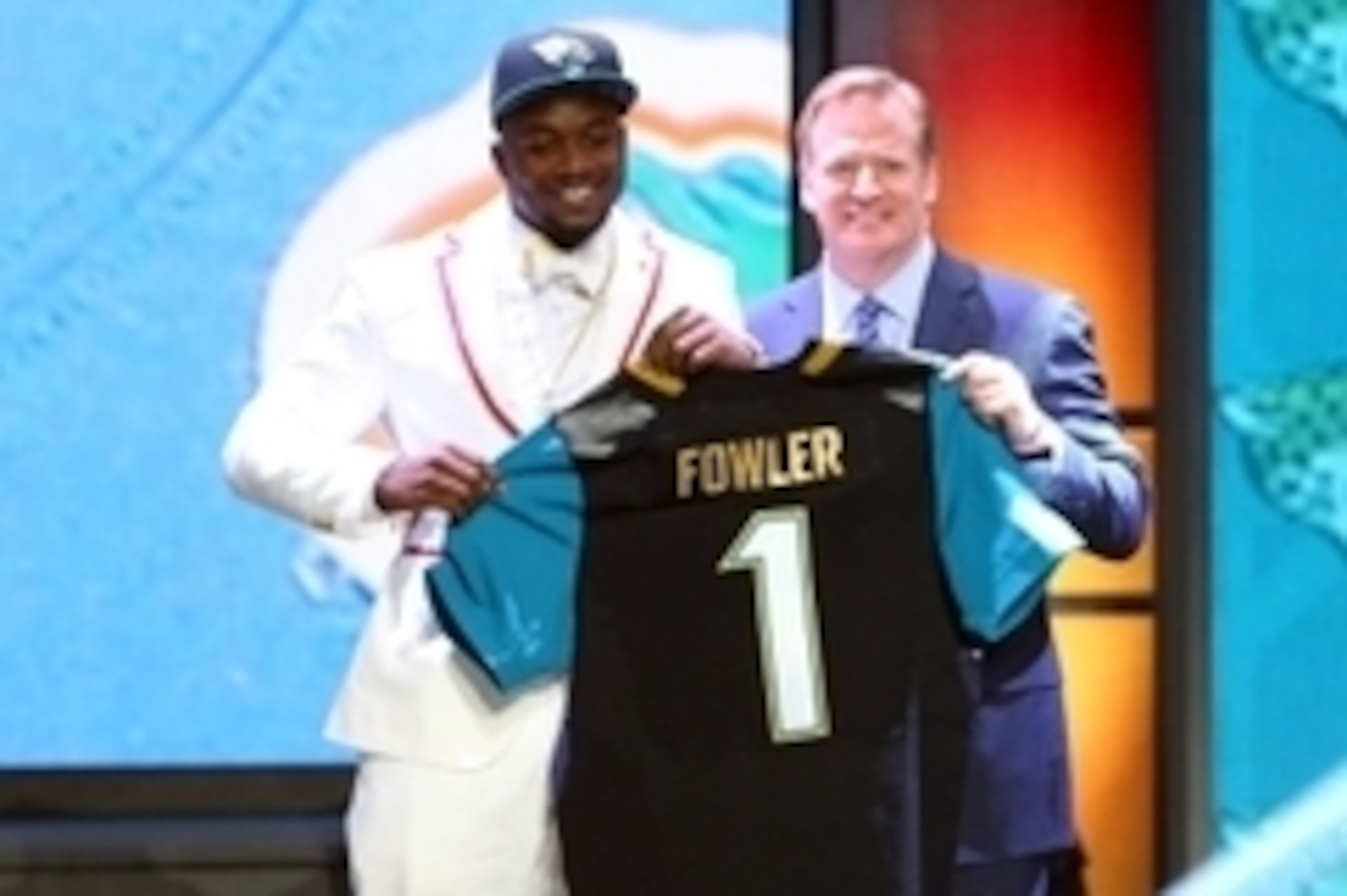 Apr 30, 2015; Chicago, IL, USA; Dante Fowler, Jr (Florida) greets NFL commissioner Roger Goodell is selected by the Jacksonville Jaguars as the number three overall pick in the first round of the 2015 NFL Draft at the Auditorium Theatre of Roosevelt Unive