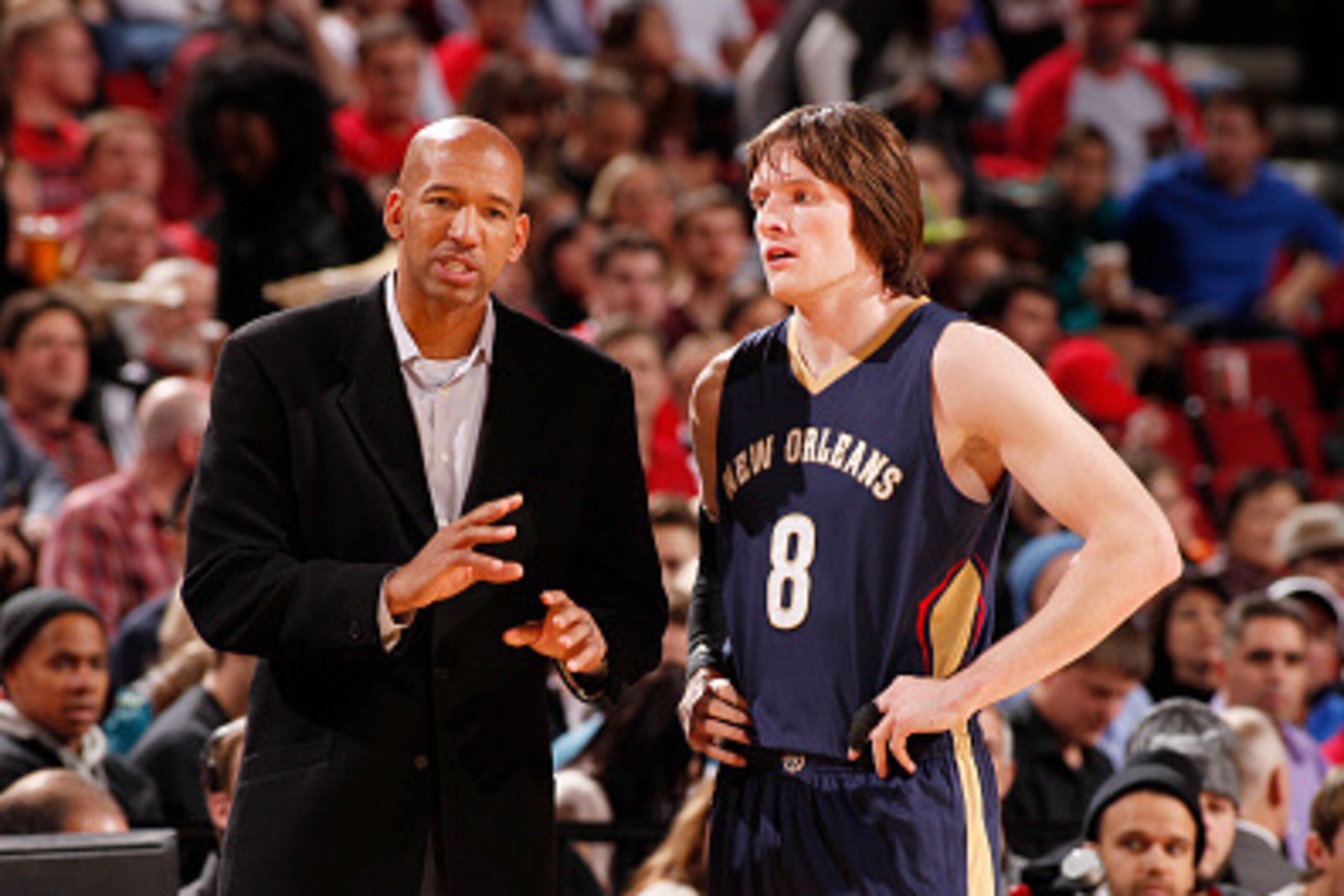 PORTLAND, OR - NOVEMBER 17: Monty Williams of the New Orleans Pelicans speaks with Luke Babbitt #8 during the game on November 17, 2014 at the Moda Center Arena in Portland, Oregon. NOTE TO USER: User expressly acknowledges and agrees that, by downloading