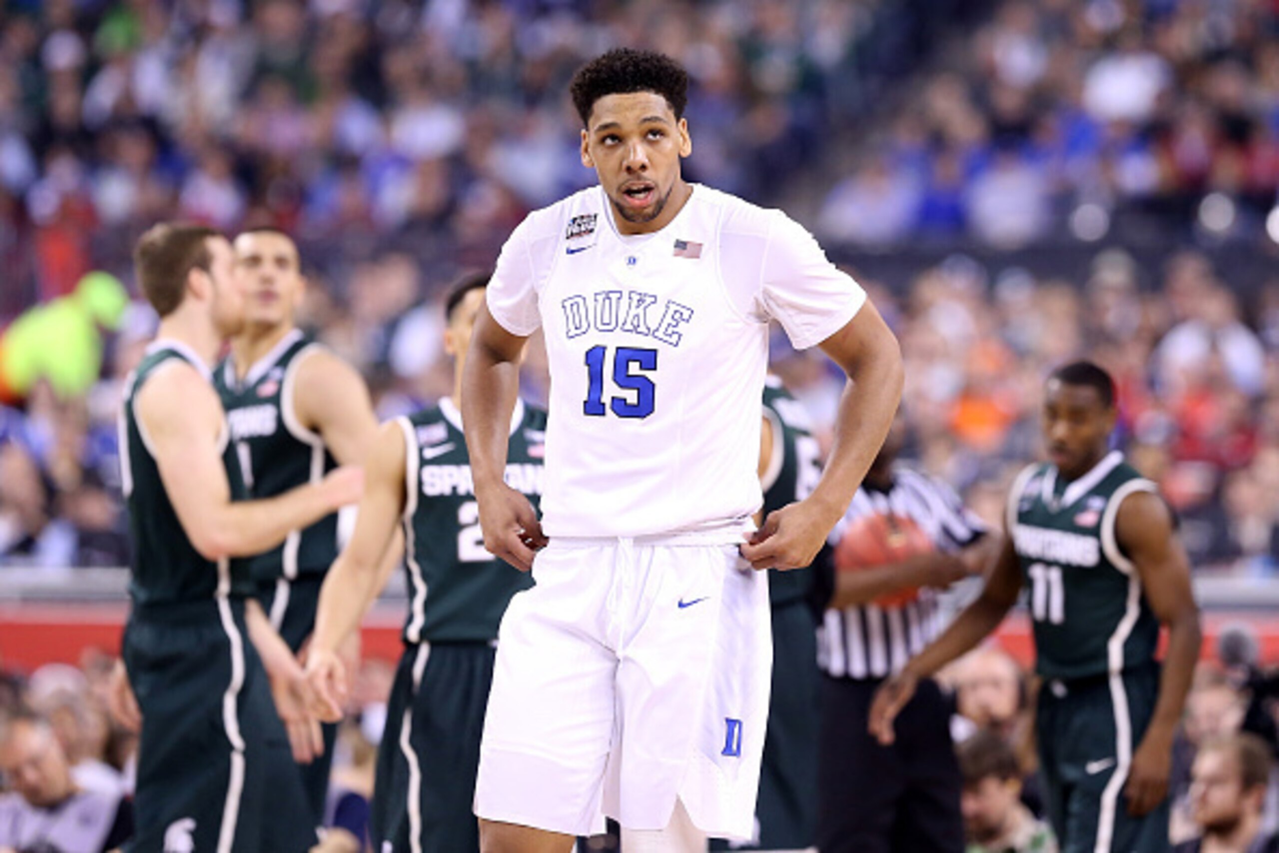 INDIANAPOLIS, IN - APRIL 04: Jahlil Okafor #15 of the Duke Blue Devils looks on after a play in the first half against the Michigan State Spartans during the NCAA Men's Final Four Semifinal at Lucas Oil Stadium on April 4, 2015 in Indianapolis, Indiana.  