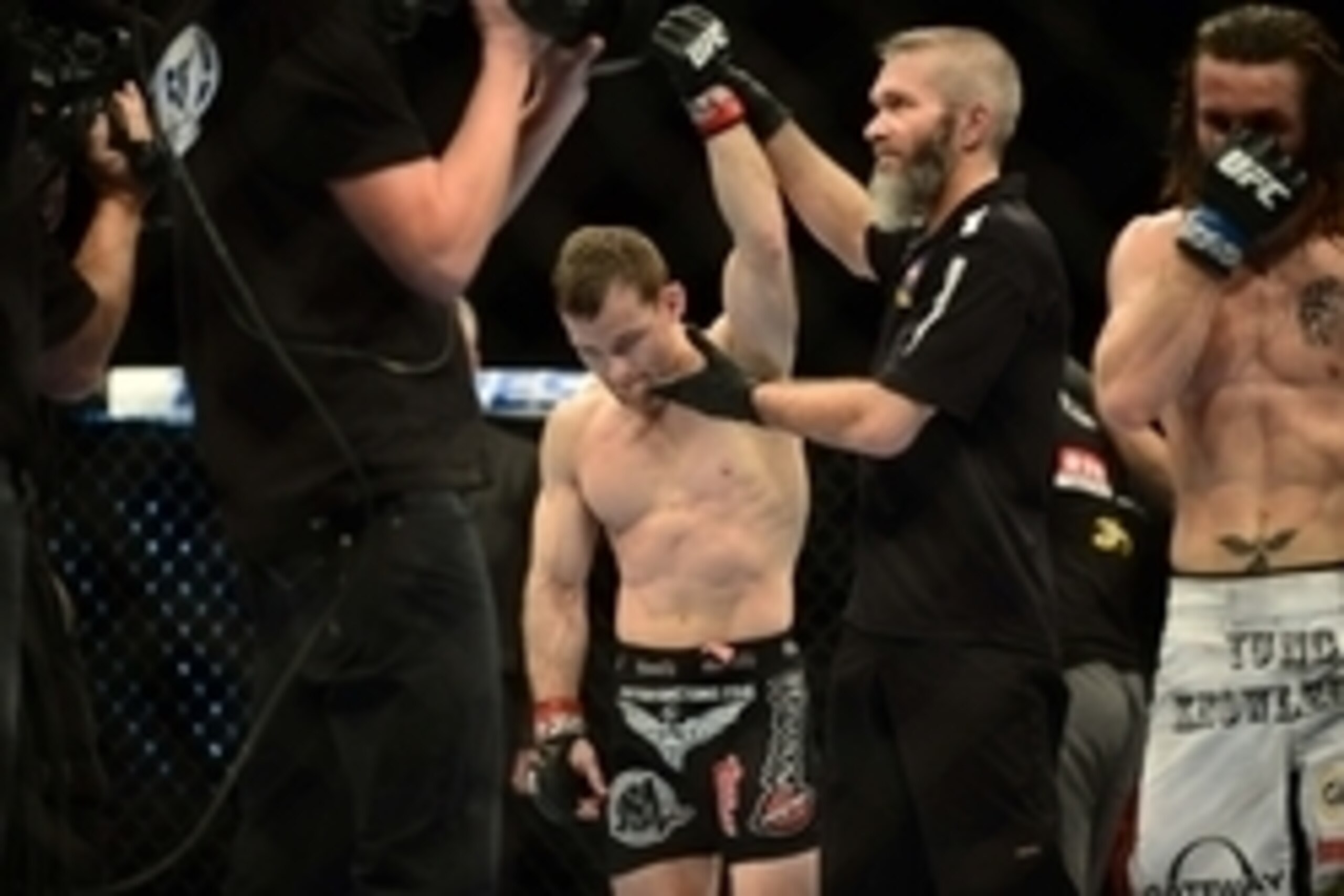 Feb 14, 2015; Broomfield, CO, USA; Zach Makovsky (red) celebrates his win over Timothy Elliott (blue) during UFC Fight Night at the 1stBANK Center. Mandatory Credit: Ron Chenoy-USA TODAY Sports