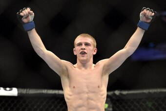 BRISBANE, AUSTRALIA - DECEMBER 07:  Justin Scoggins of the USA celebrates his TKO victory over Richie Vaculik in their flyweight fight during the UFC Fight Night event at the Brisbane Entertainment Centre on December 7, 2013 in Brisbane, Australia.  (Phot