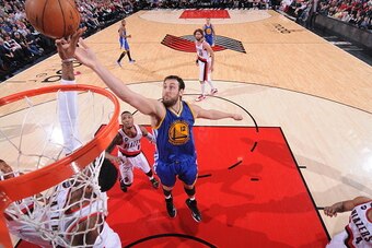 PORTLAND, OR - MARCH 24:  Andrew Bogut #12 of the Golden State Warriors shoots against the Portland Trail Blazers on March 24, 2015 at the Moda Center in Portland, Oregon. NOTE TO USER: User expressly acknowledges and agrees that, by downloading and or us