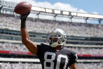 Sep 7, 2014; East Rutherford, NJ, USA; Oakland Raiders receiver Rod Streater (80) celebrates after scoring on a 12-yard touchdown reception in the first quarter against the New York Jets at MetLife Stadium. Mandatory Credit: Kirby Lee-USA TODAY Sports
