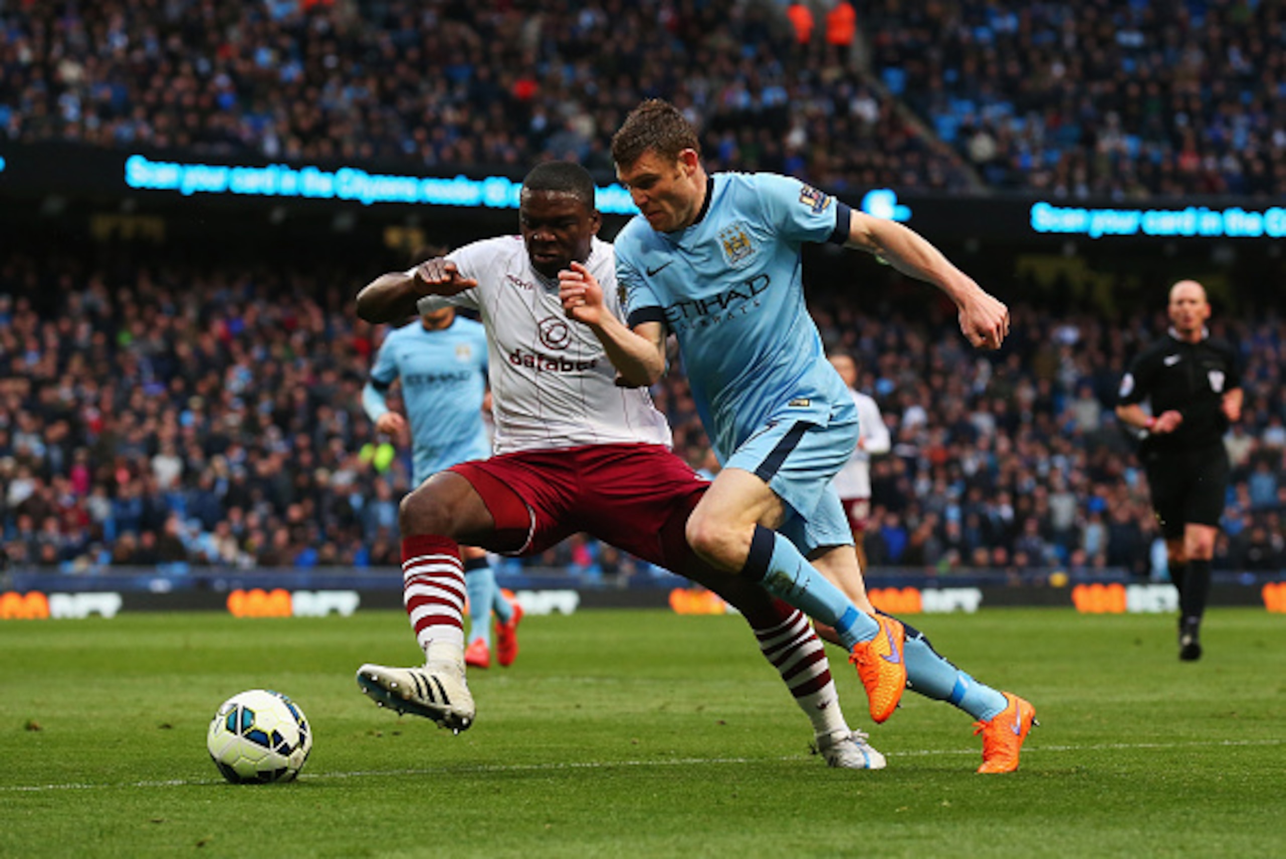 MANCHESTER, ENGLAND - APRIL 25: James Milner of Manchester City takes on Jores Okore of Aston Villa during the Barclays Premier League match between Manchester City and Aston Villa at Etihad Stadium on April 25, 2015 in Manchester, England. (Photo by Ale MANCHESTER, ENGLAND - APRIL 25: James Milner of Manchester City takes on Jores Okore of Aston Villa during the Barclays Premier League match between Manchester City and Aston Villa at Etihad Stadium on April 25, 2015 in Manchester, England. (Photo by Ale