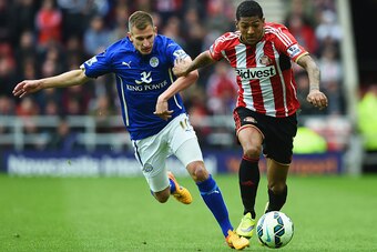SUNDERLAND, ENGLAND - MAY 16: Marc Albrighton of Leicester City and Patrick van Aanholt of Sunderland battle for the ball during the Barclays Premier League match between Sunderland and Leicester City at Stadium of Light on May 16, 2015 in Sunderland, Eng