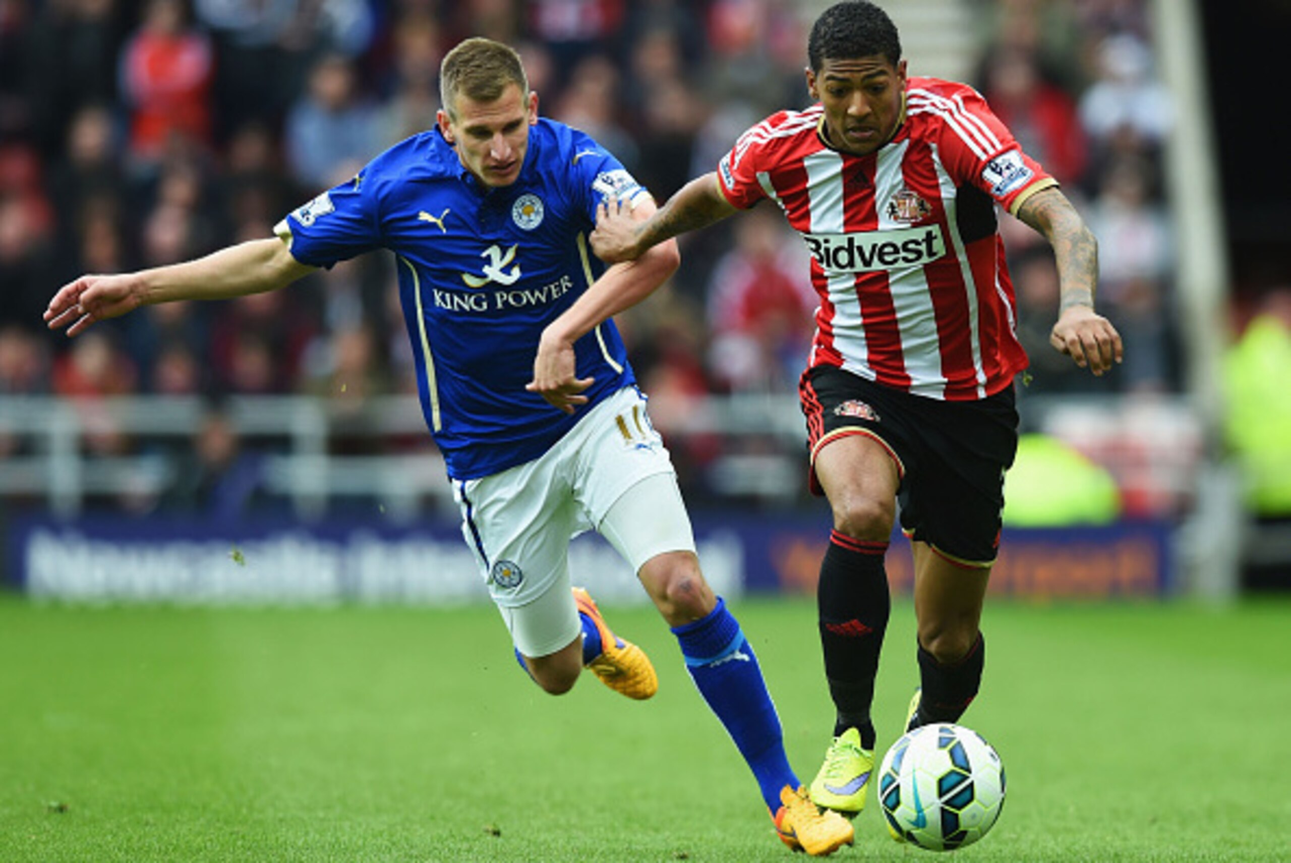 SUNDERLAND, ENGLAND - MAY 16: Marc Albrighton of Leicester City and Patrick van Aanholt of Sunderland battle for the ball during the Barclays Premier League match between Sunderland and Leicester City at Stadium of Light on May 16, 2015 in Sunderland, Eng