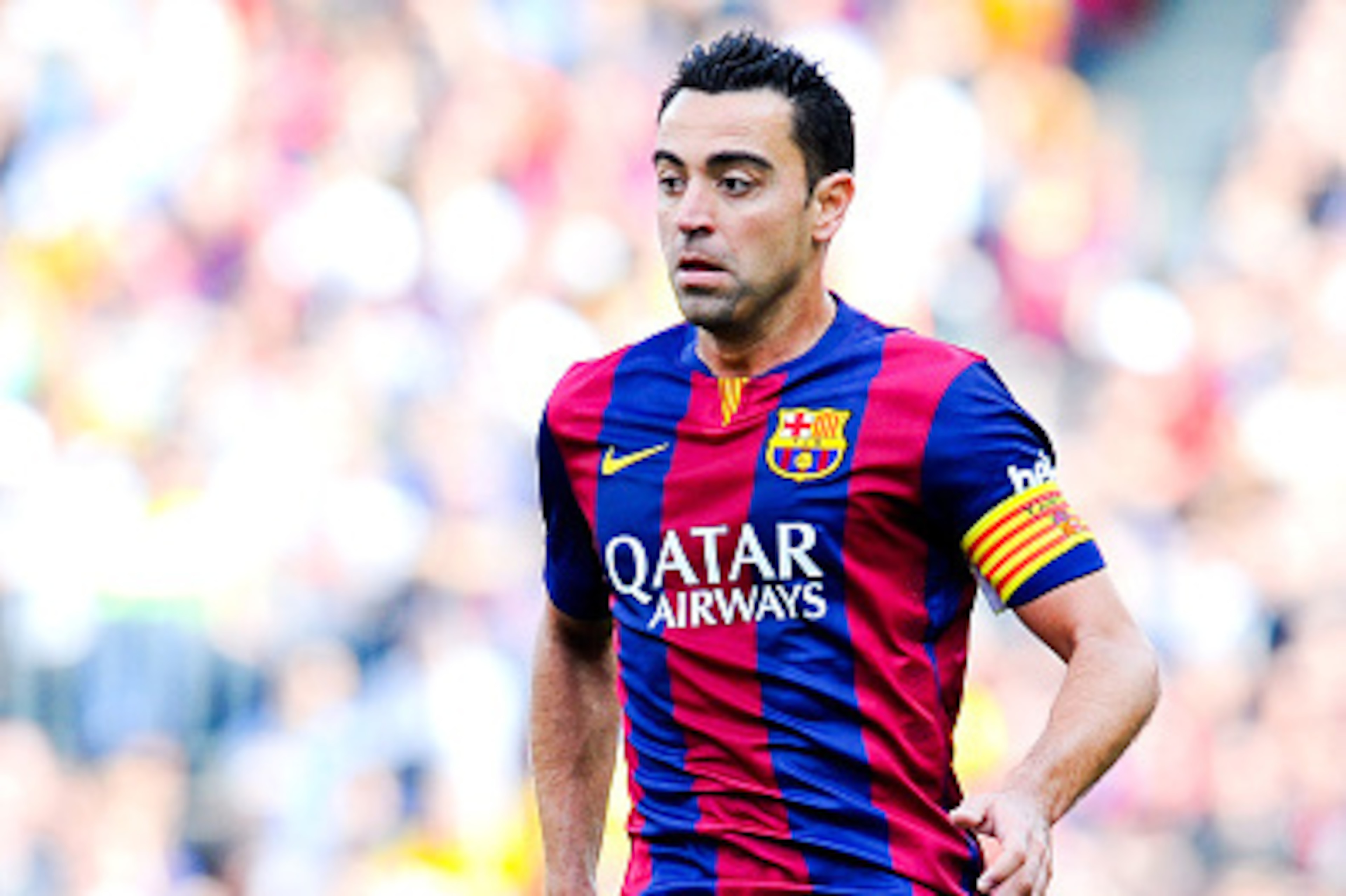BARCELONA, SPAIN - APRIL 18:  Xavi Hernandez of FC Barcelona runs with the ball during the La Liga match between FC Barcelona and Valencia CF at Camp Nou on April 18, 2015 in Barcelona, Spain.  (Photo by David Ramos/Getty Images)