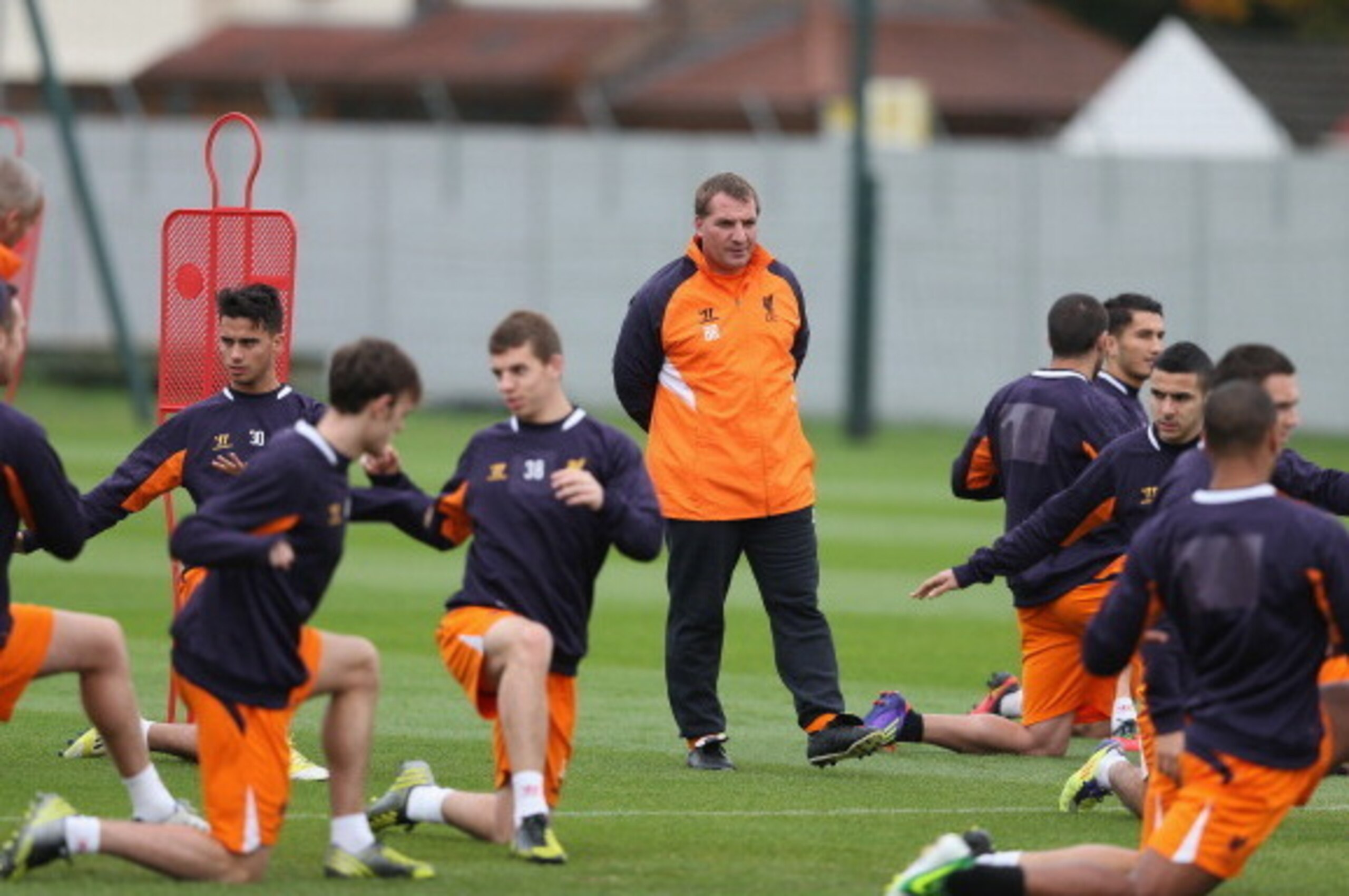 LIVERPOOL, ENGLAND - OCTOBER 24: Liverpool manager Brendan Rodgers watches his players during a training session ahead of their UEFA Europa League group match against FC Anzhi Makhachkala at Melwood Training Ground on October 24, 2012 in Liverpool, Engla LIVERPOOL, ENGLAND - OCTOBER 24: Liverpool manager Brendan Rodgers watches his players during a training session ahead of their UEFA Europa League group match against FC Anzhi Makhachkala at Melwood Training Ground on October 24, 2012 in Liverpool, Engla